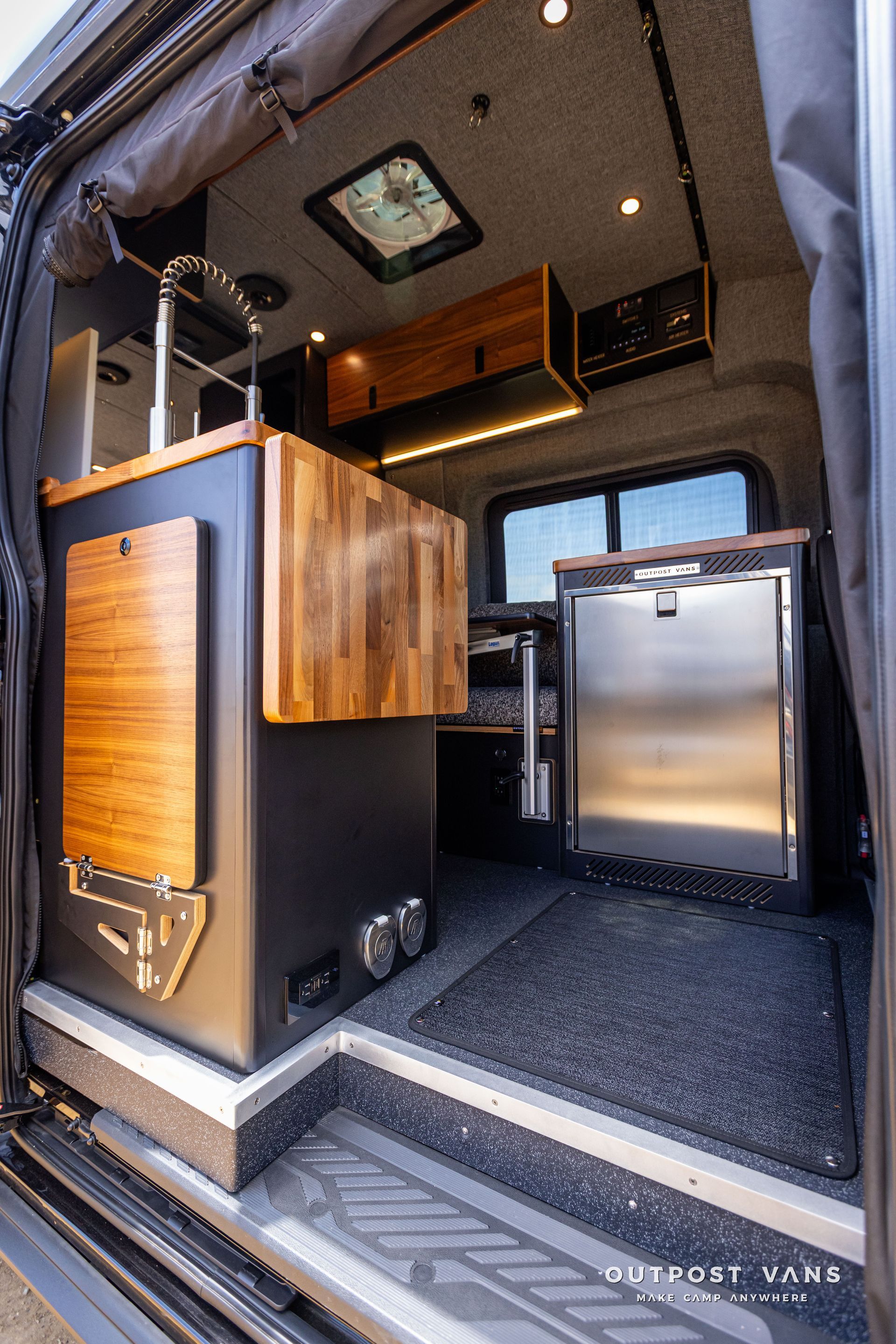 Outpost Vans custom built camper van Ford Transit 148 AWD. 12v fridge isotherm cruise 130 drawer