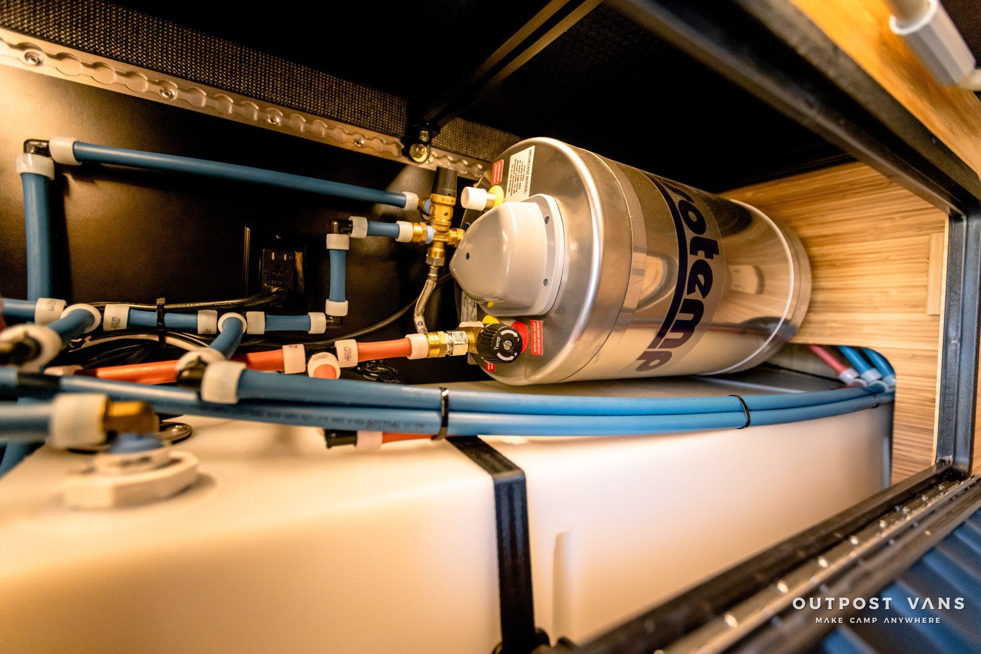 A water heater is sitting inside of a van.