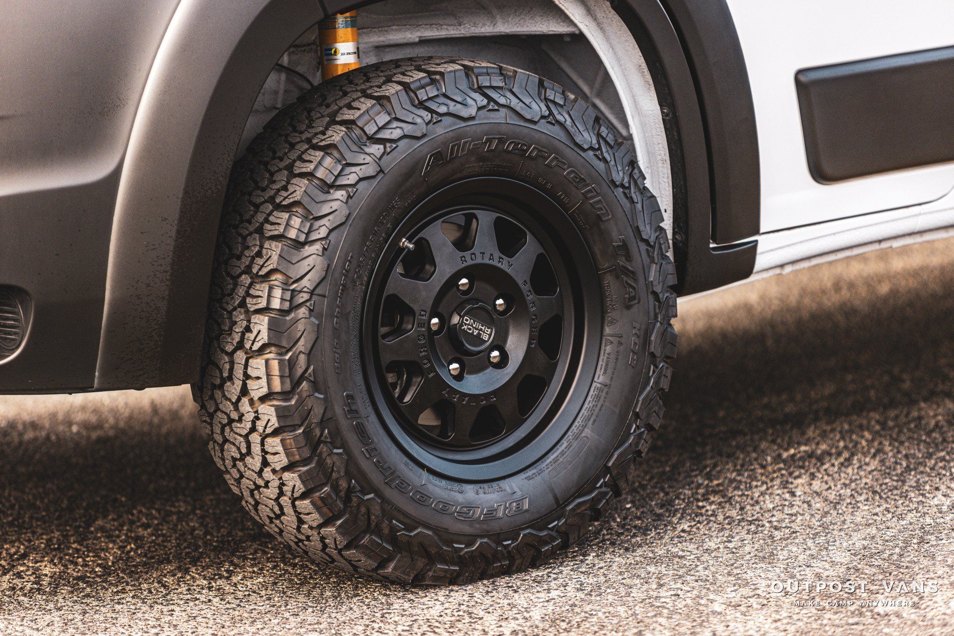 a close up of a tire on a white van .