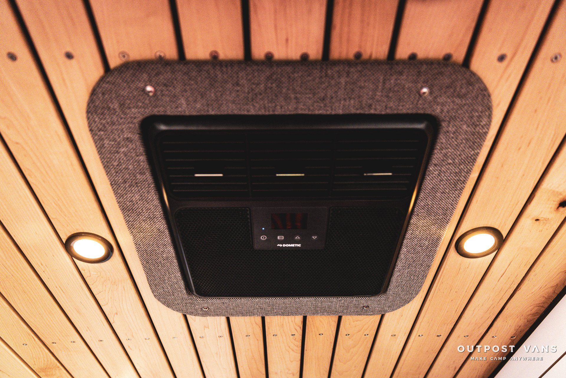 A wooden ceiling with a ceiling fan on it
