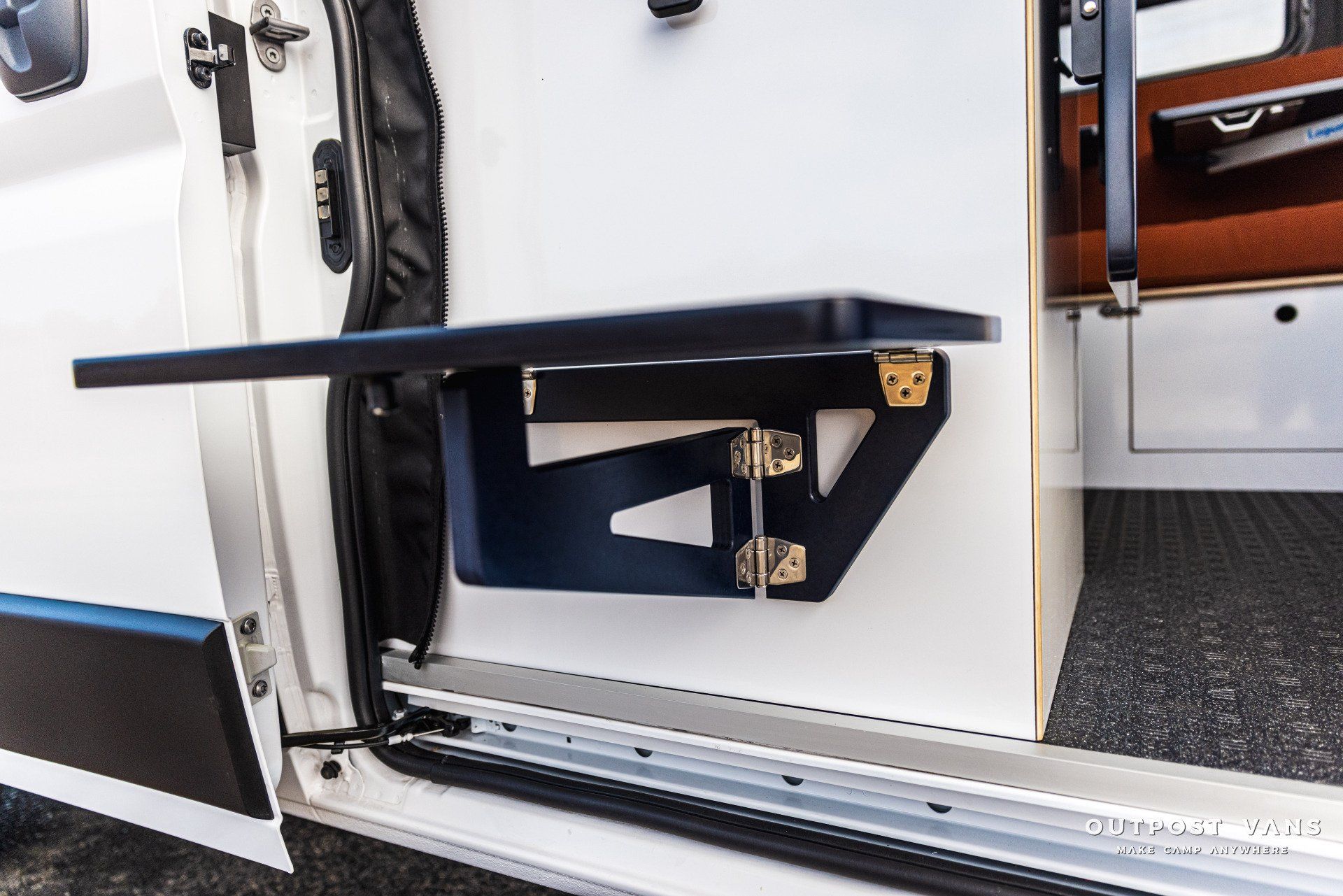 a white van with a table attached to the side of it