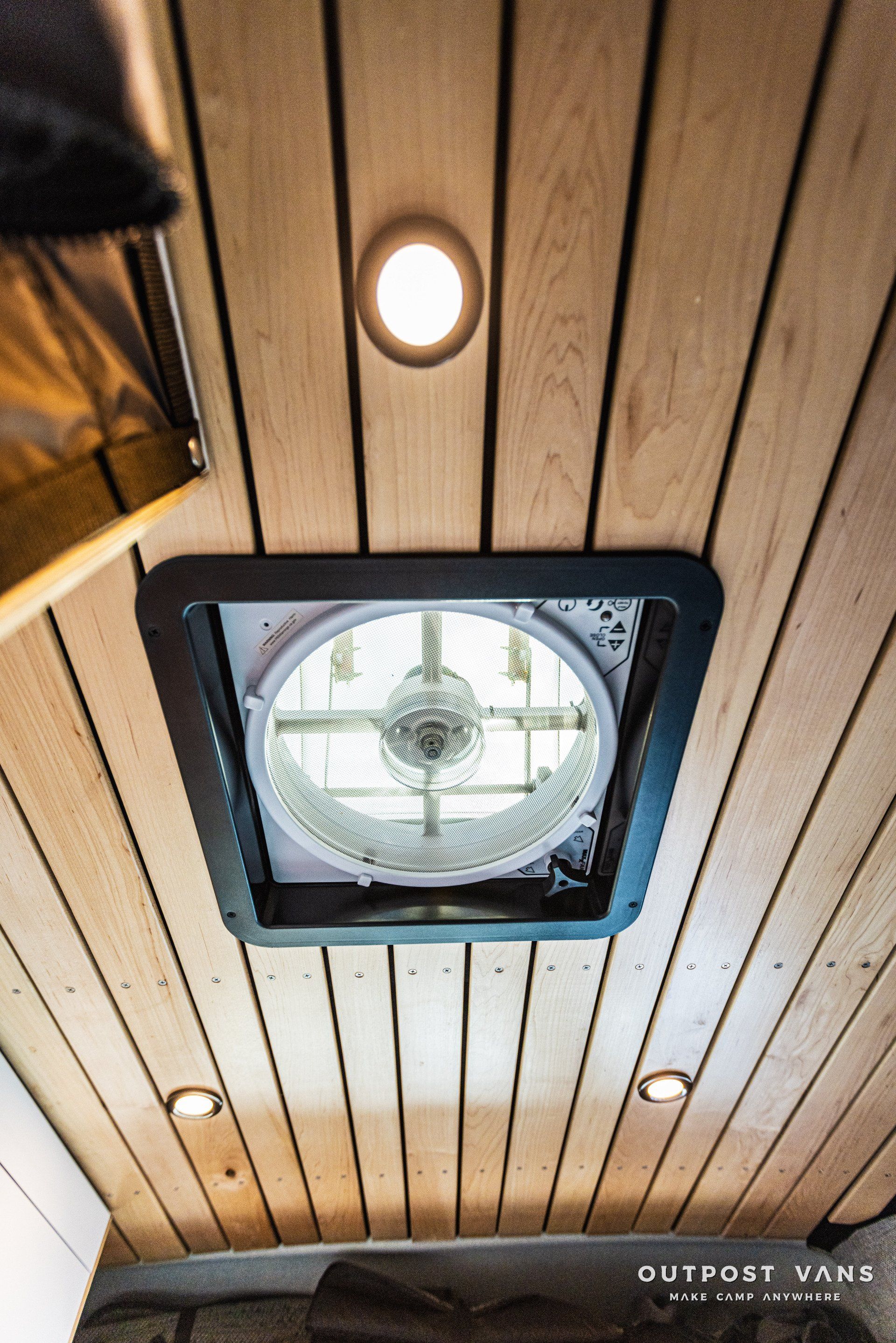 a ceiling fan is hanging from the ceiling of a van .