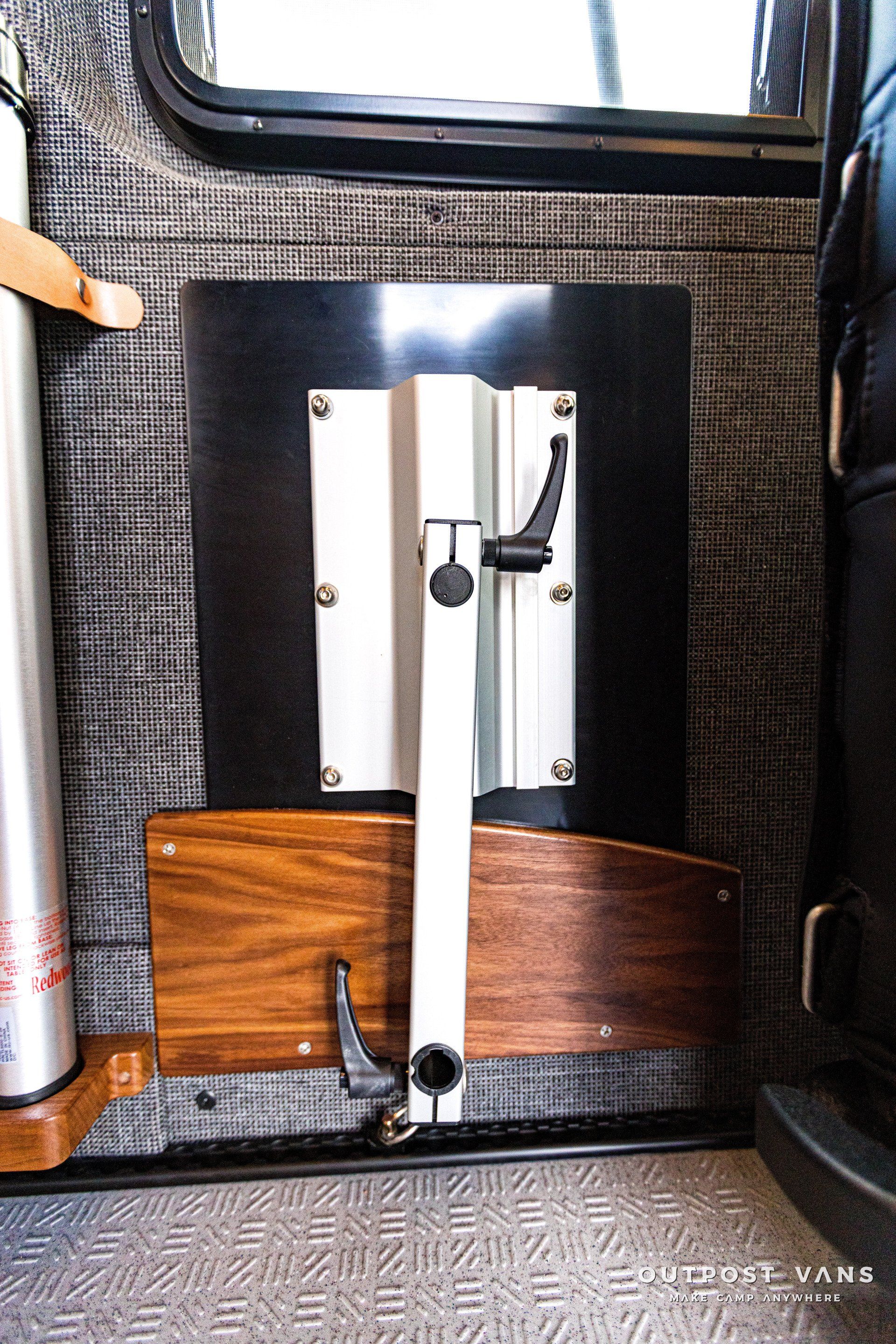 There is a table in the back of a van.