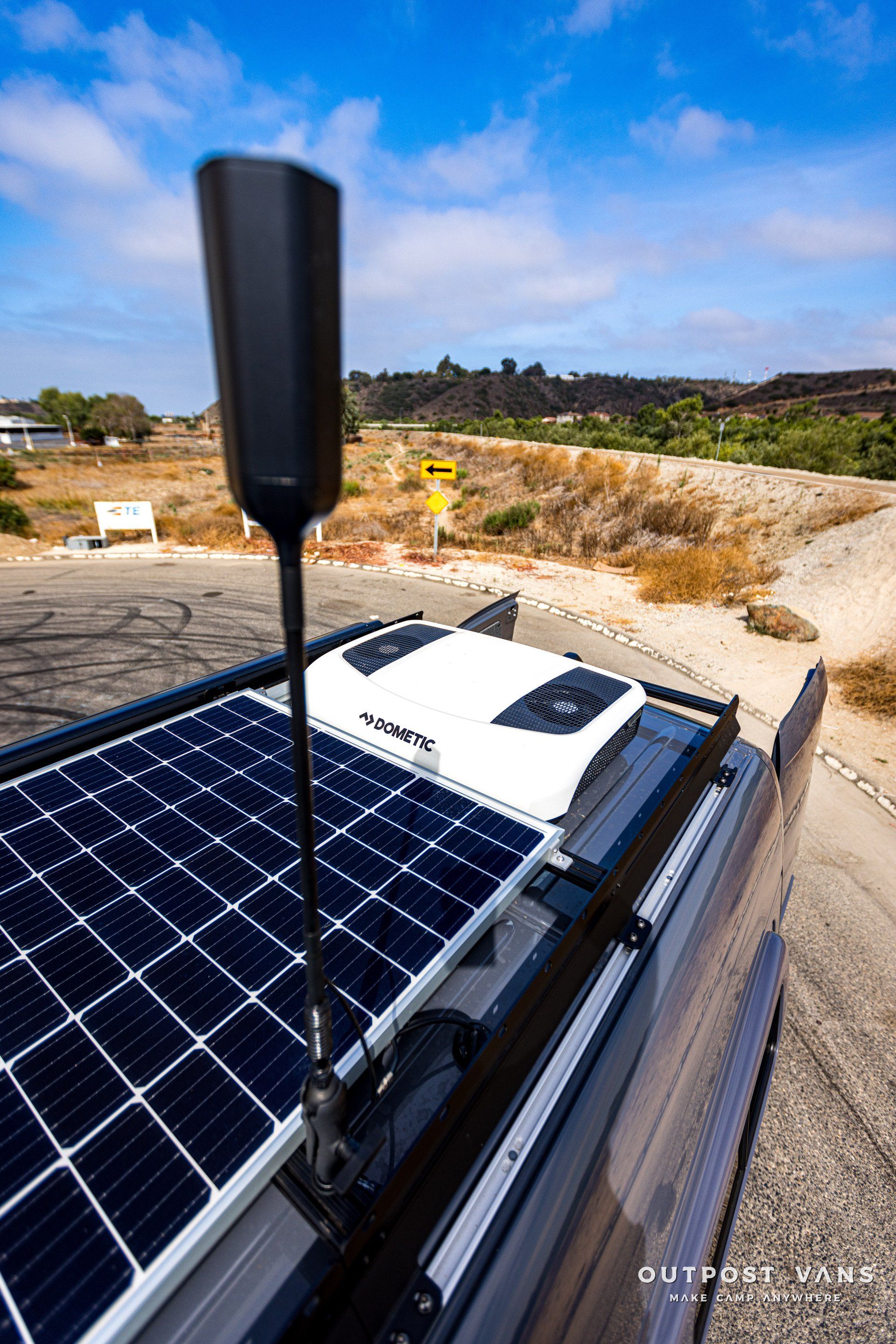 A truck with a solar panel on top of it.