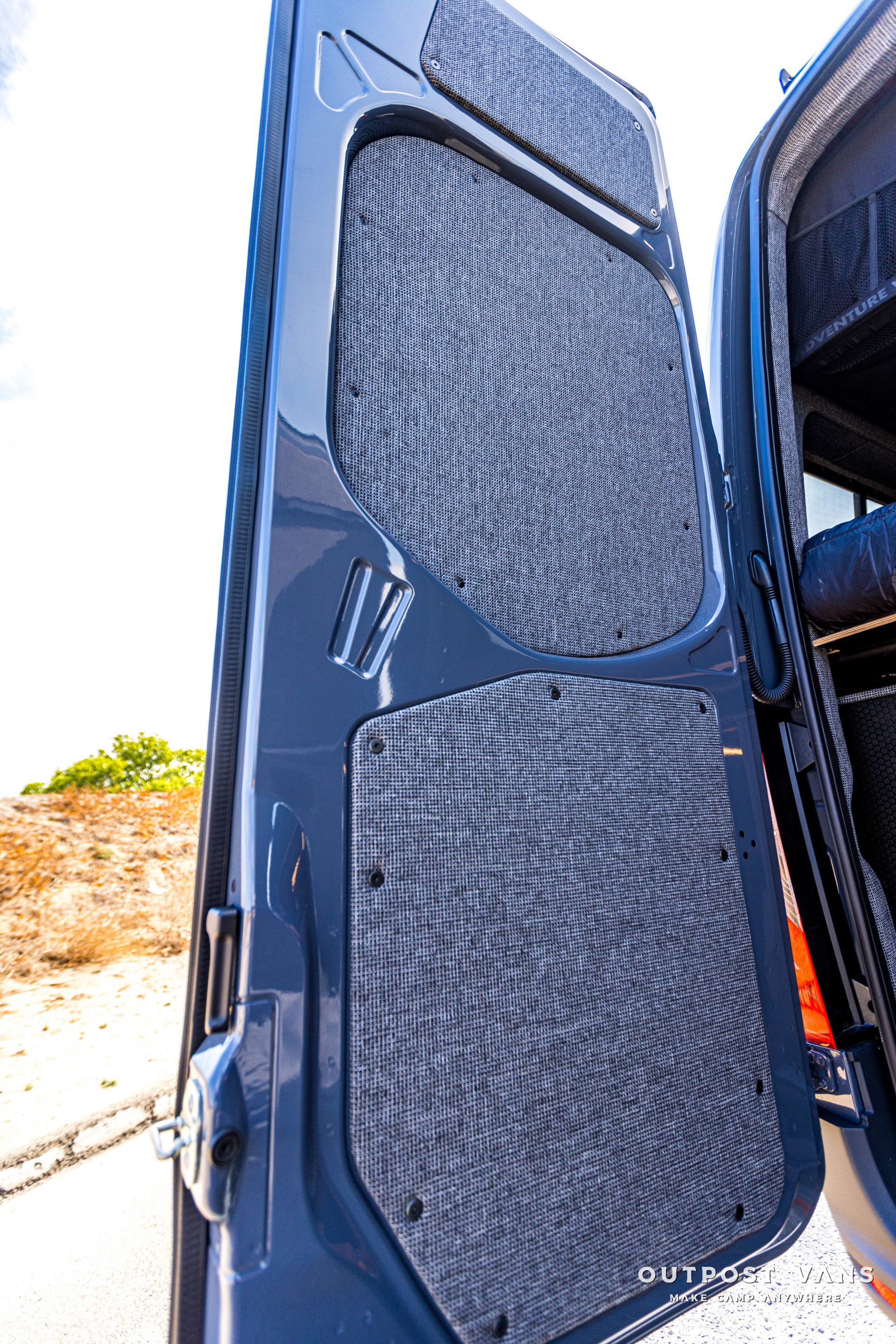 A close up of the back door of a van with the door open.