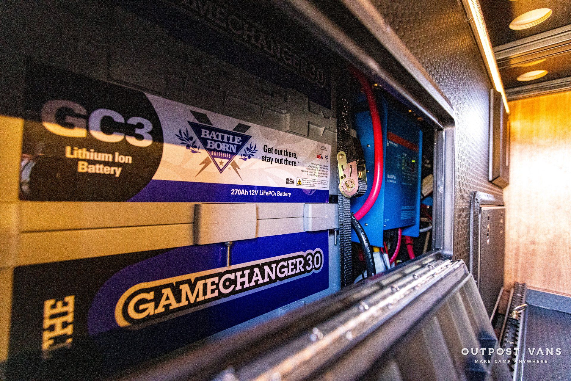 A gamechanger 30 battery is sitting inside of a van.