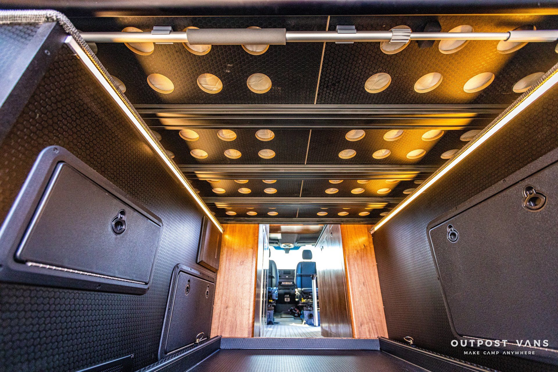 The inside of a van with a ceiling that has a lot of lights on it.
