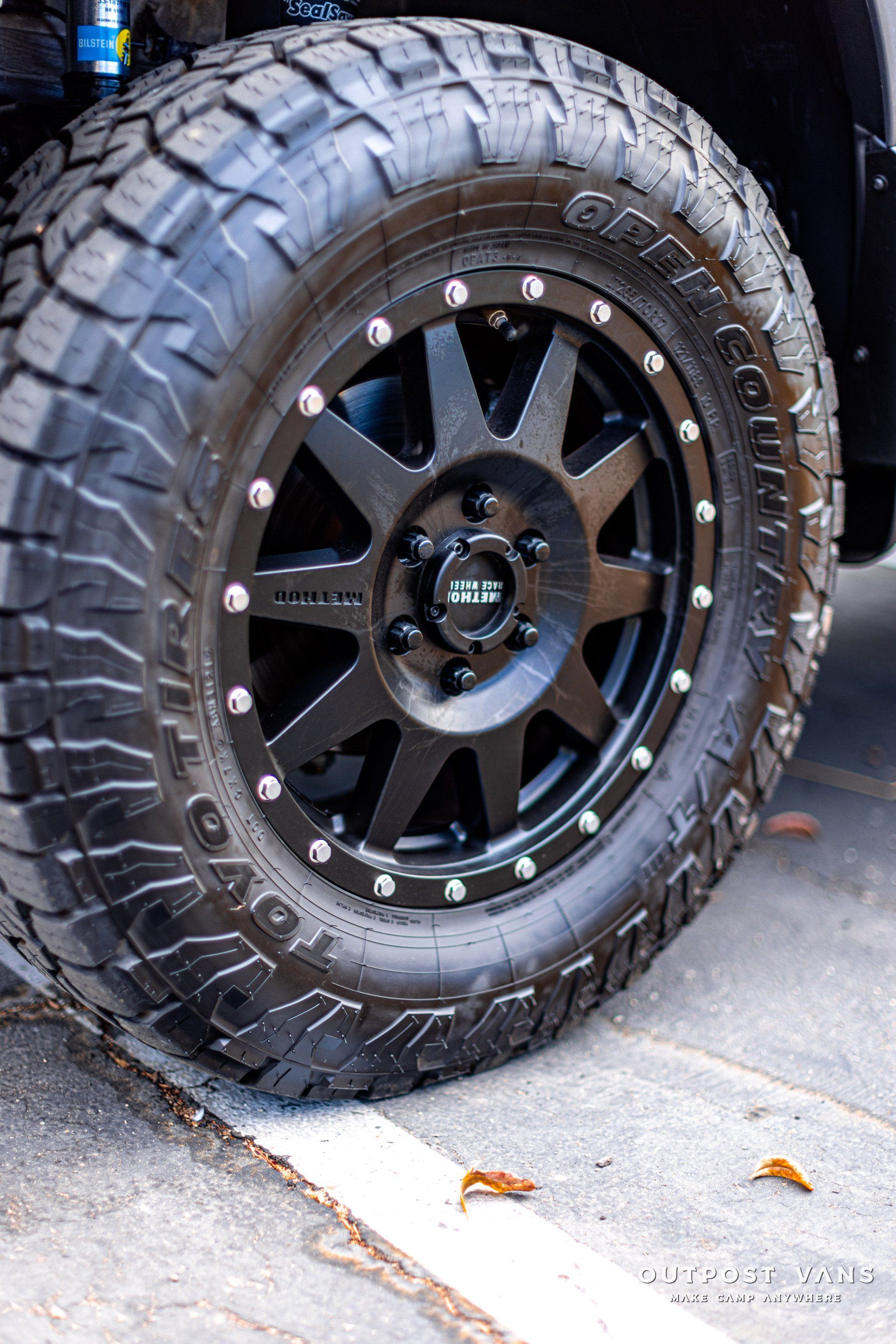 A close up of a tire and wheel on a truck.