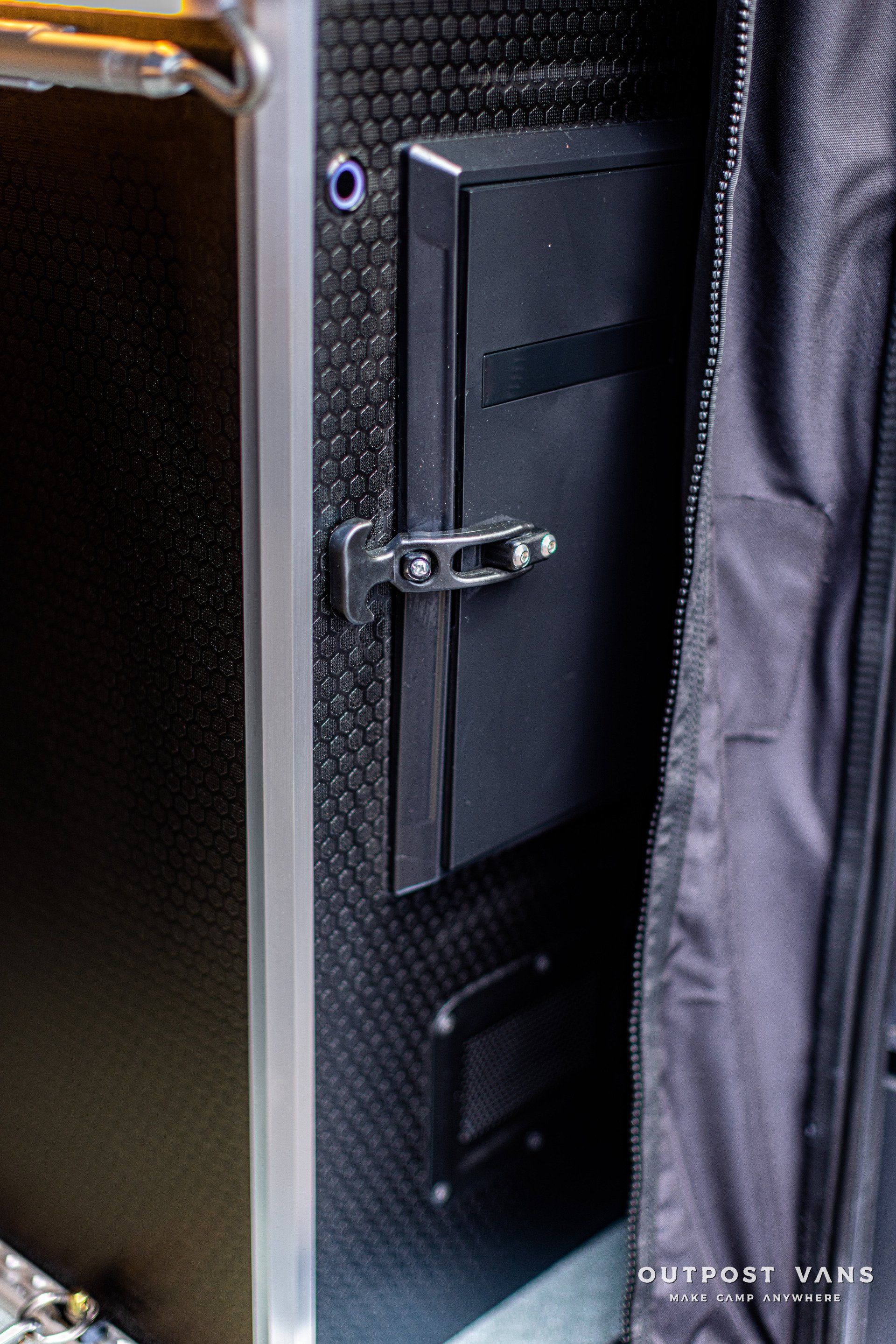 a close up of a black case with a lock on it .