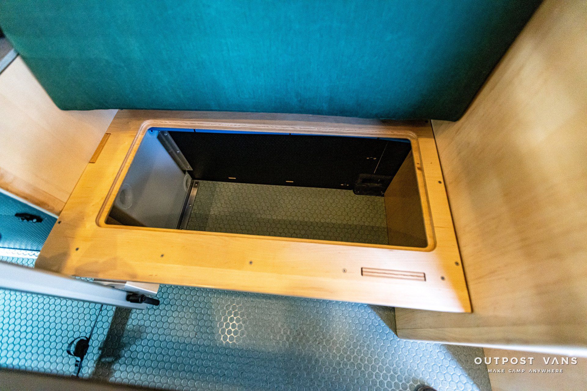 A wooden box with a mirror inside of it