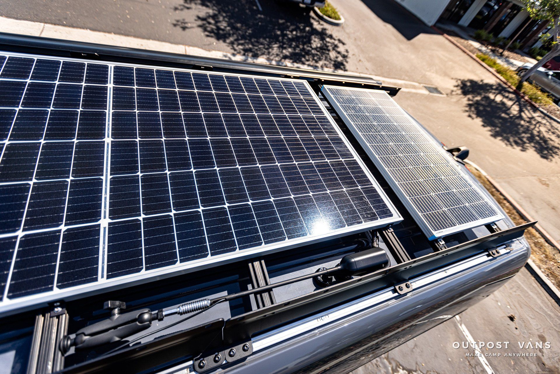 A roof of a van with solar panels on it