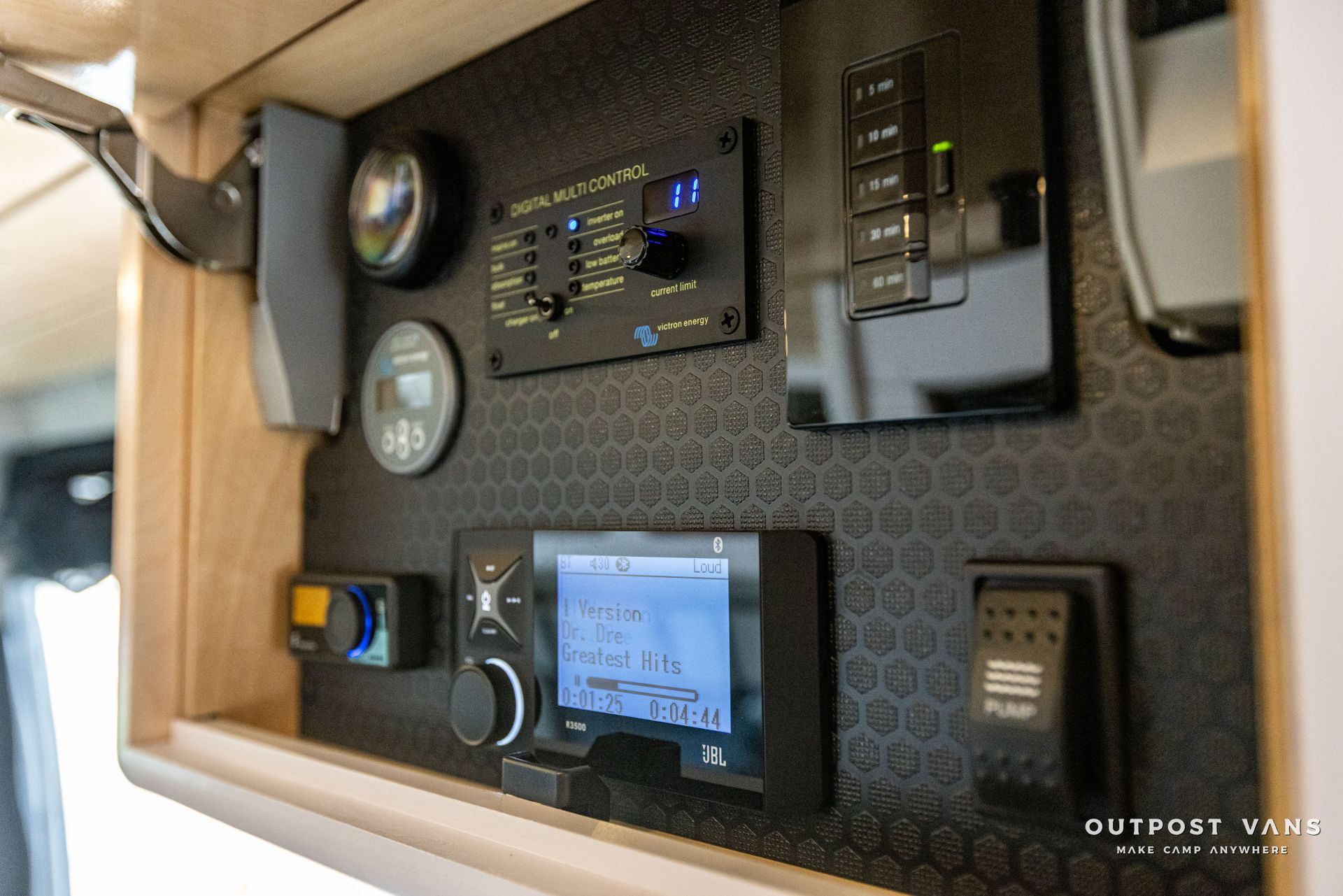 the inside of a camper van with a lot of electronics on the wall .