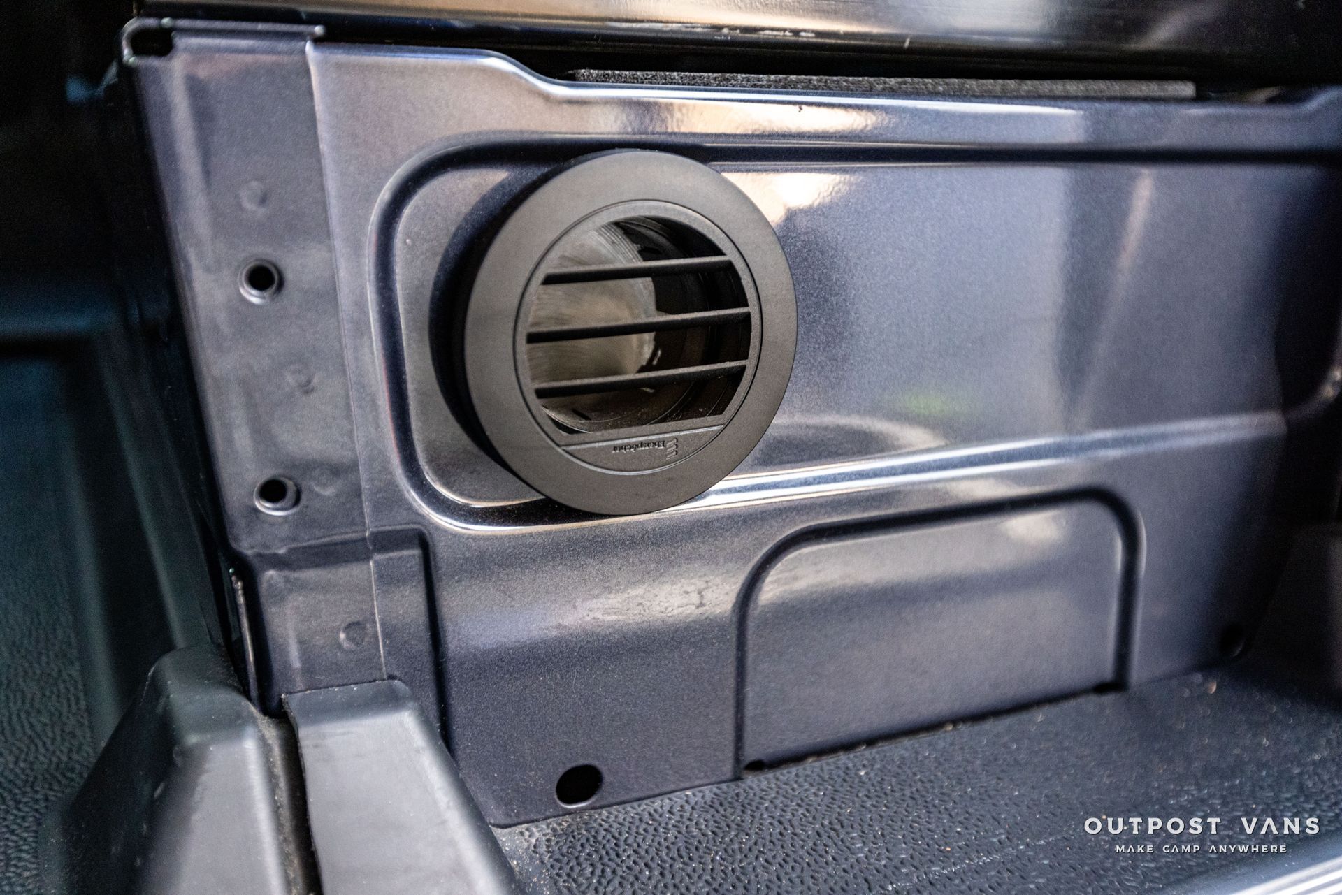 a close up of a vent on the side of a car .