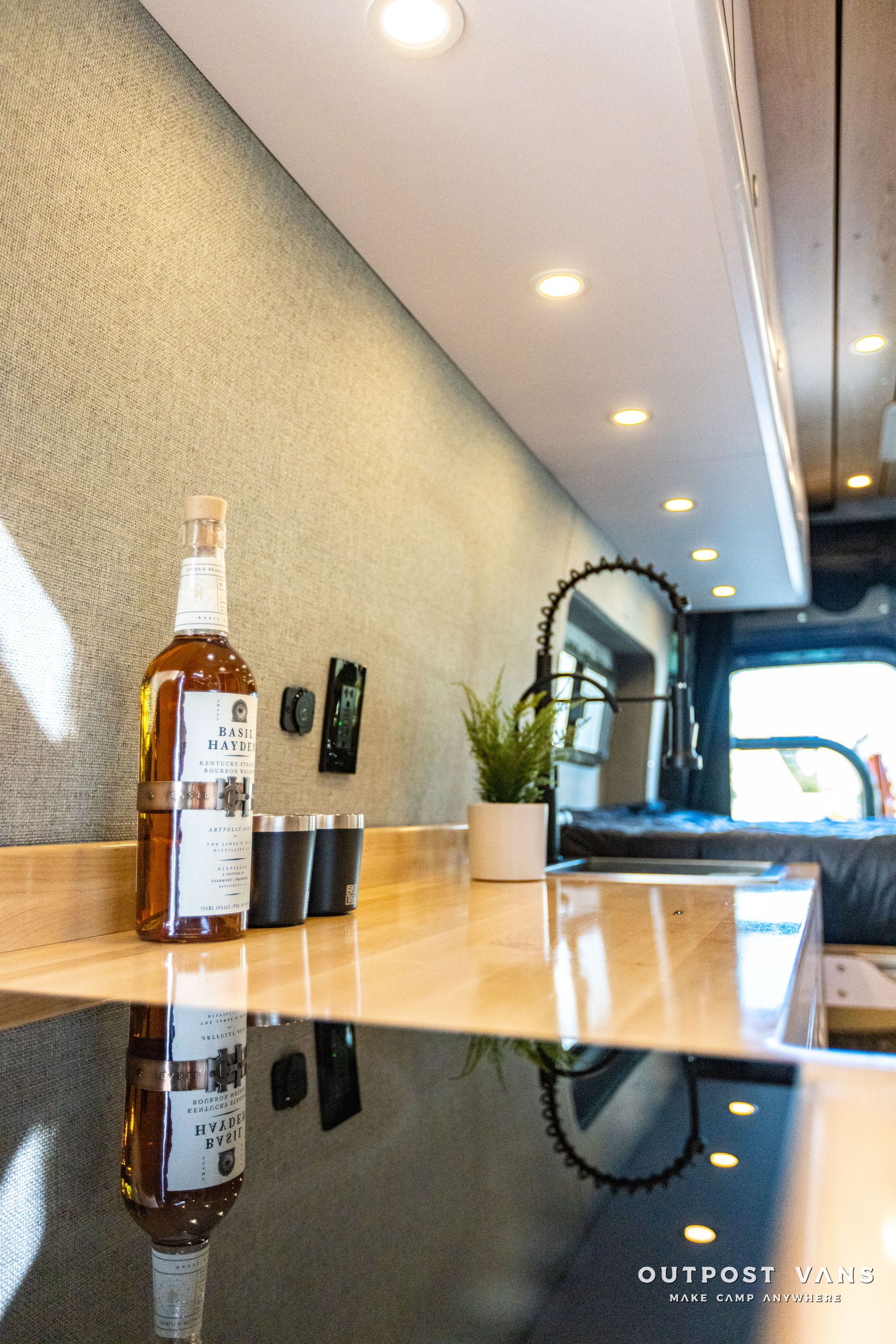 a bottle of wine is sitting on a counter in a kitchen .