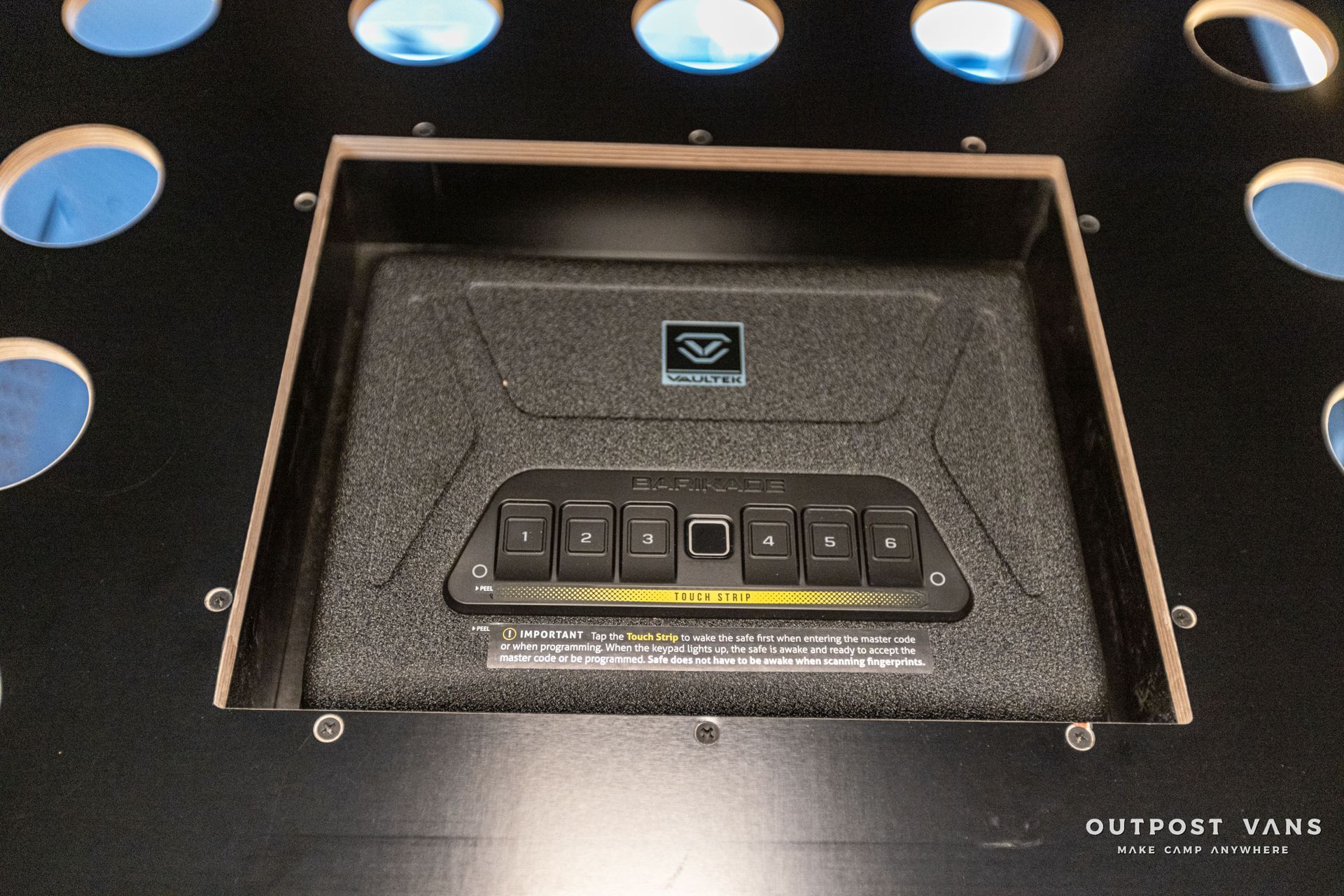 a black box with the word outpost vans on it