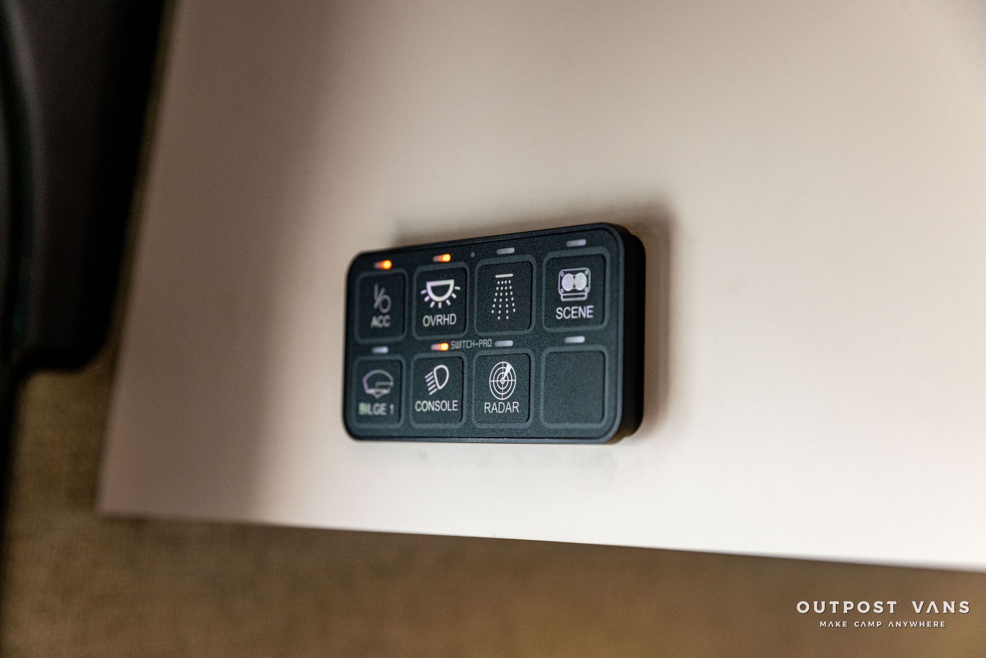 a remote control is sitting on top of a white table .