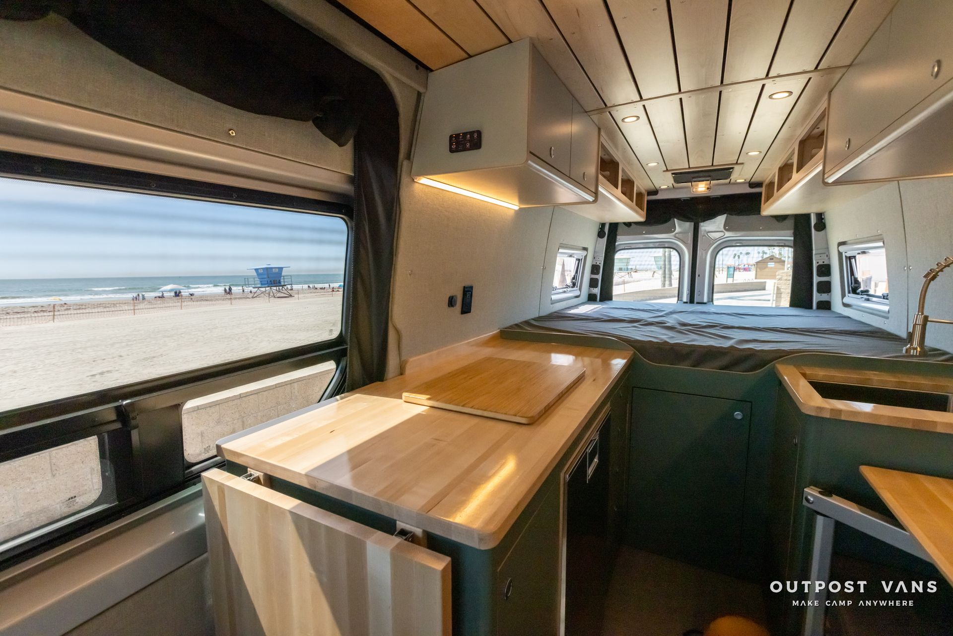 the inside of a camper van with a view of the ocean .
