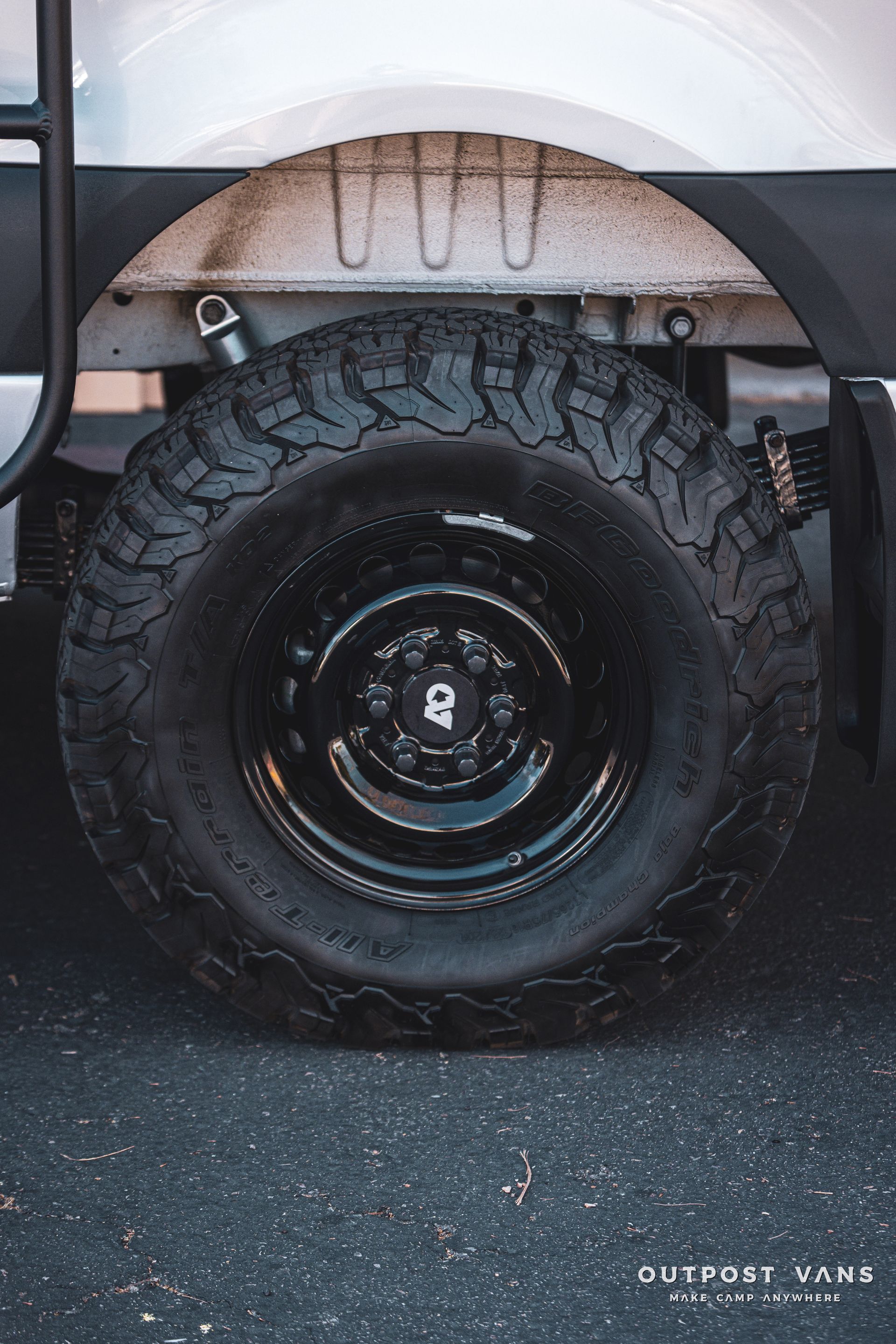 a close up of a tire on a white van .