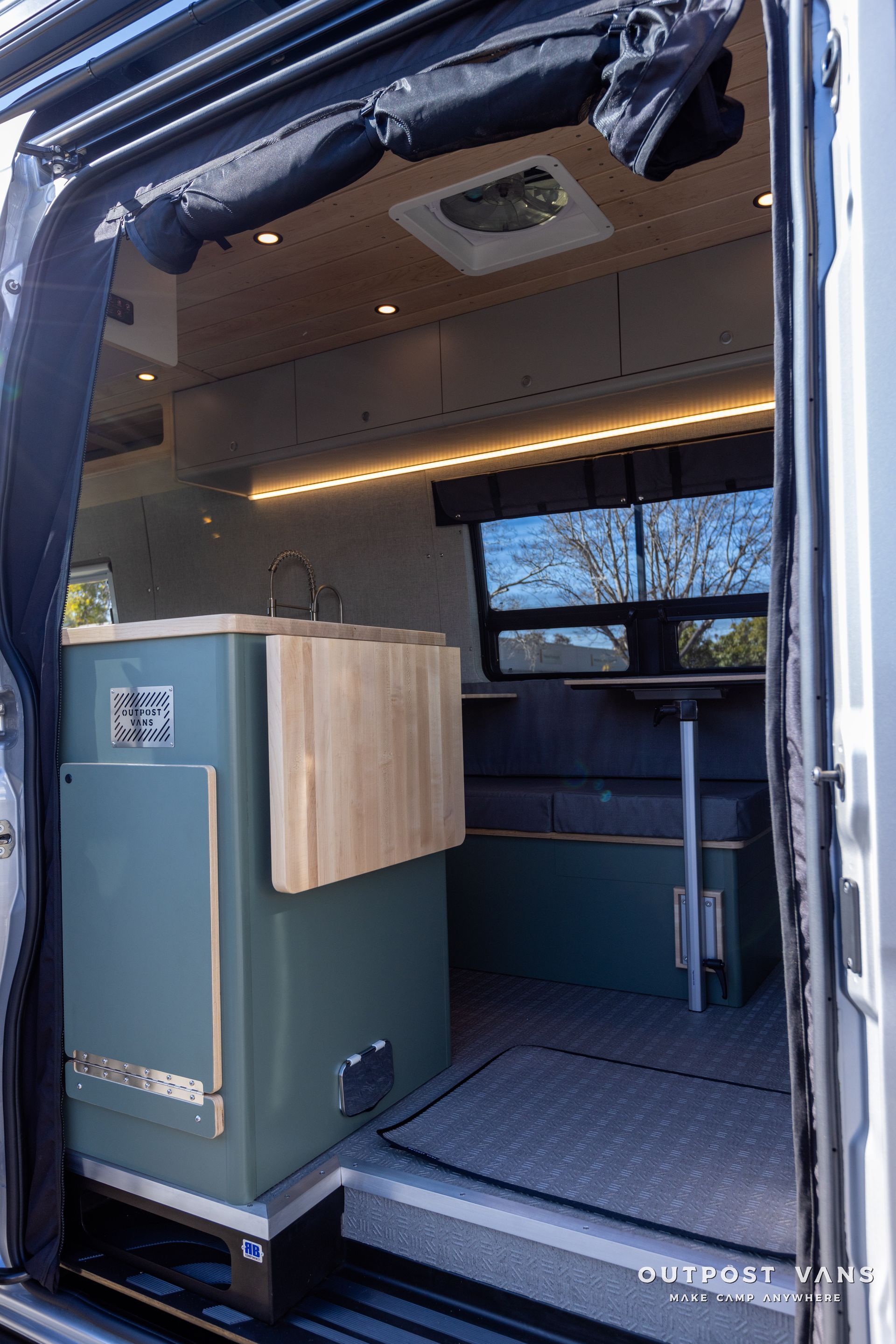 the inside of a camper van with the door open .