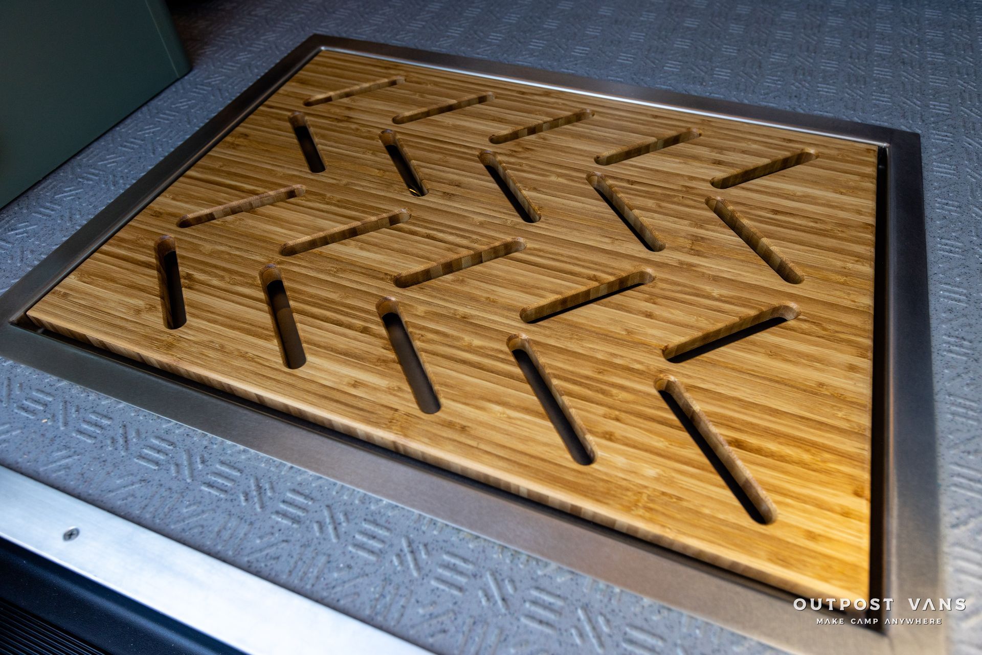 a wooden mat with arrows on it is on the floor .