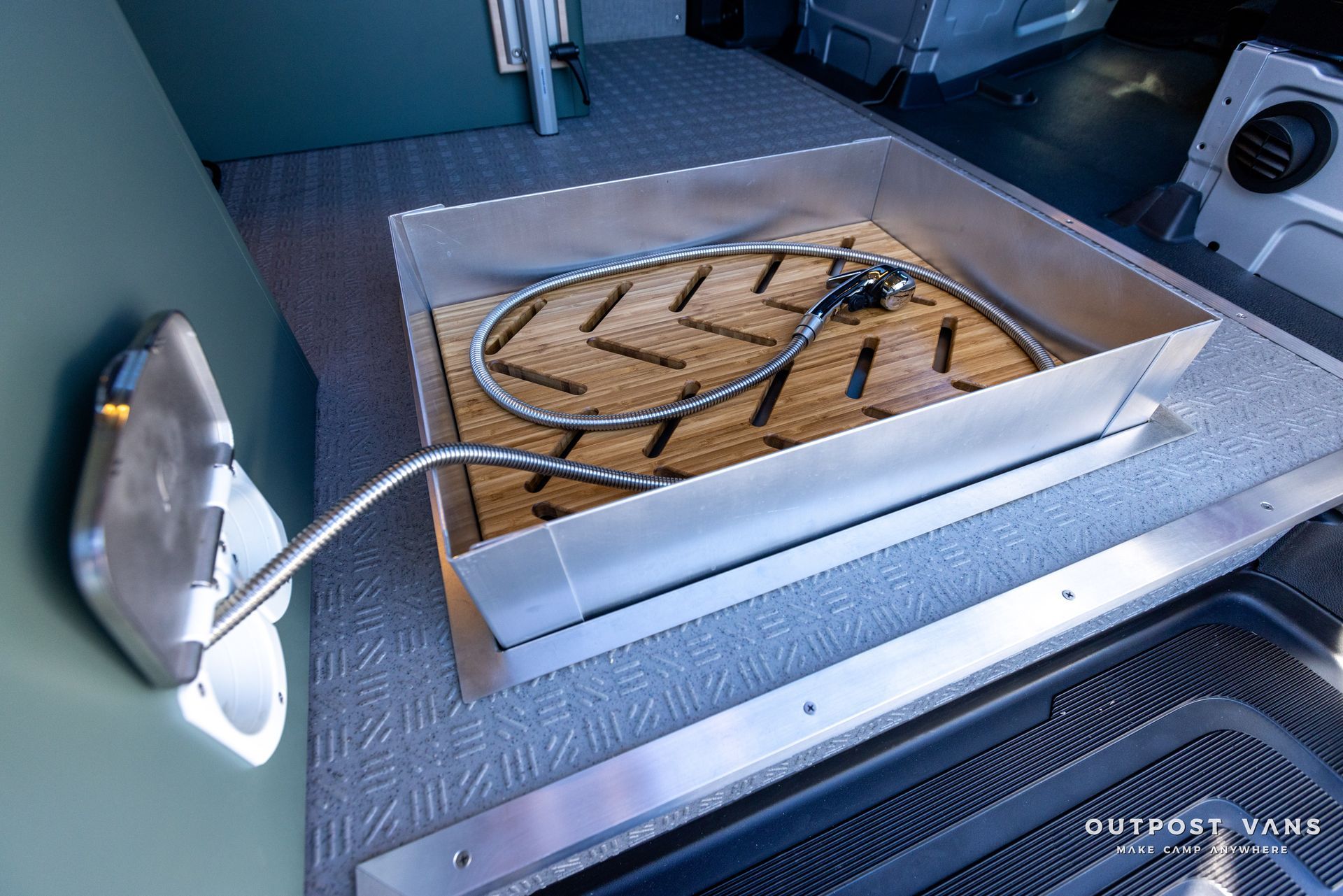 a hose is coming out of a hole in the floor .