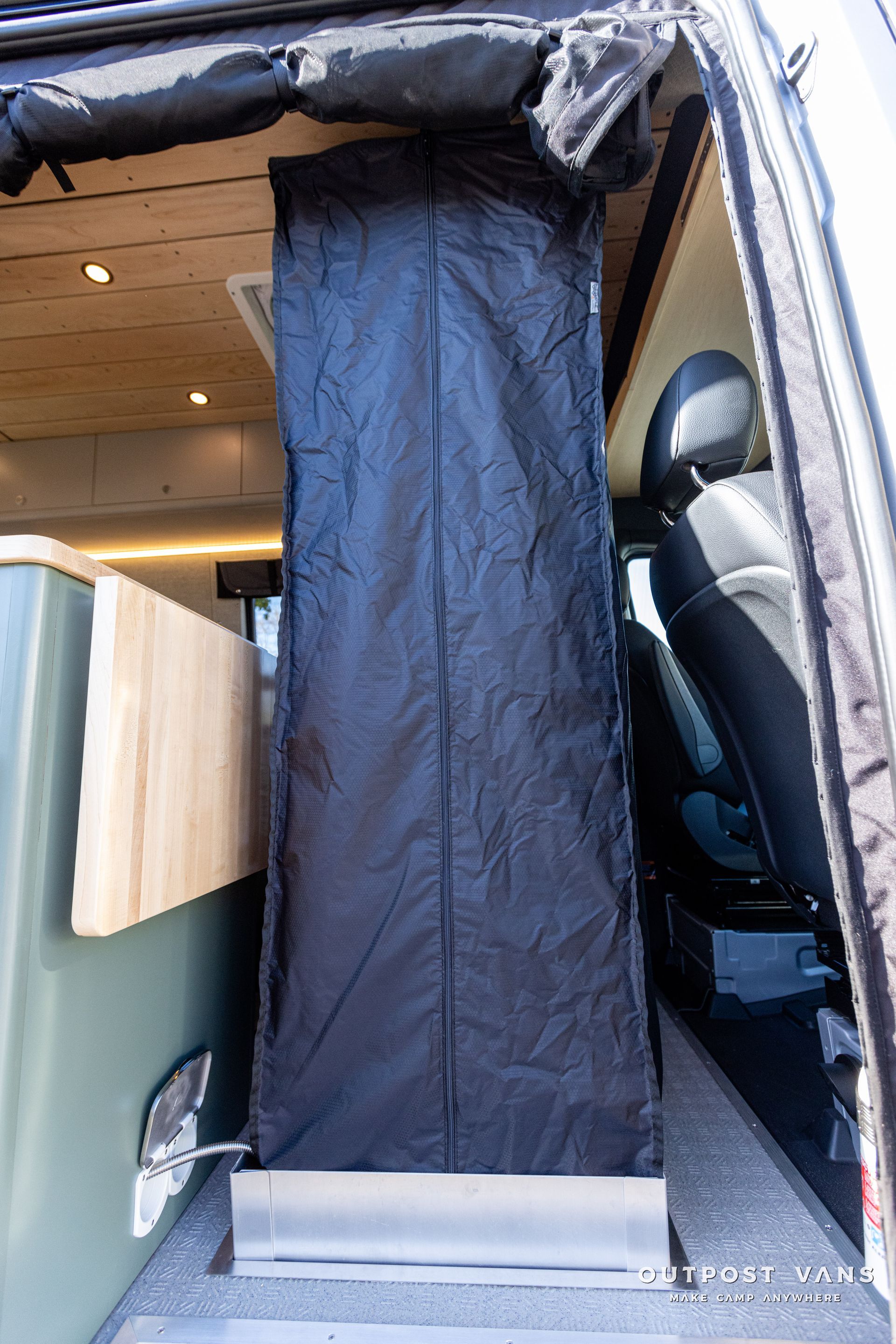 a black bag is sitting in the back of a van .