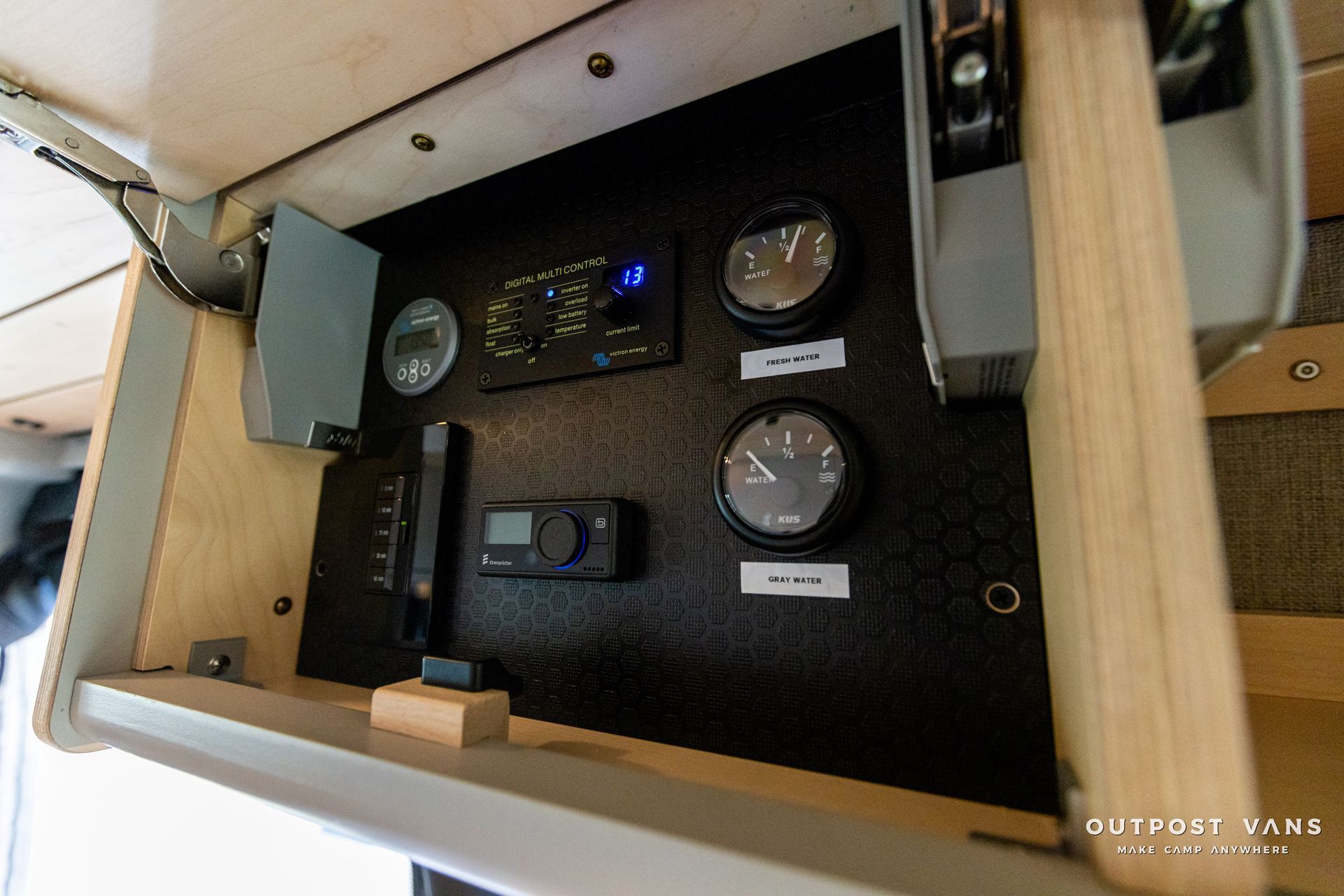 a wooden cabinet with a bunch of clocks on it