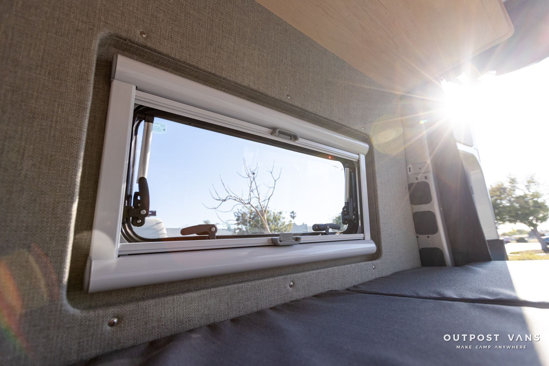 the sun is shining through the window of a van .