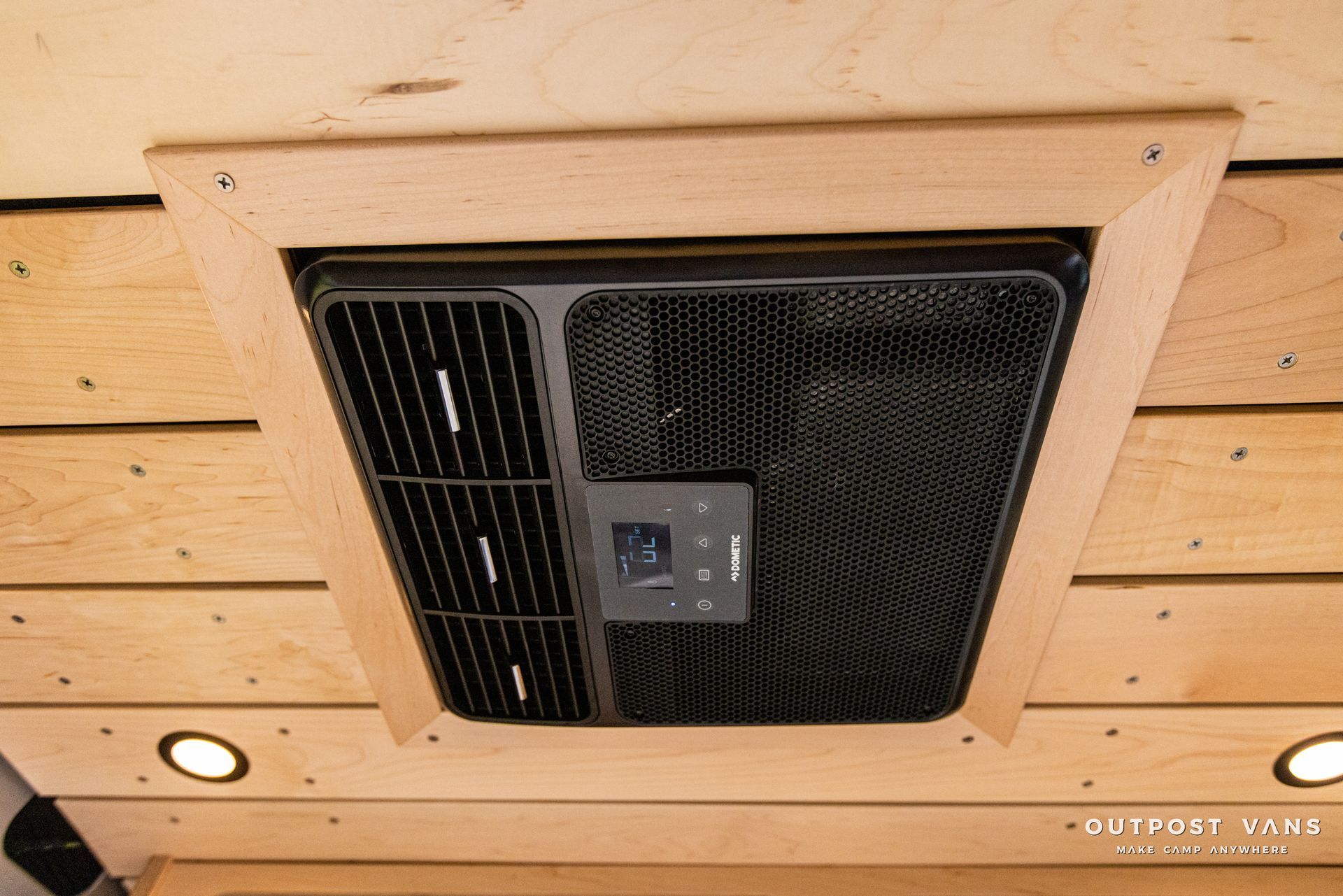 a ceiling fan is mounted on a wooden ceiling .