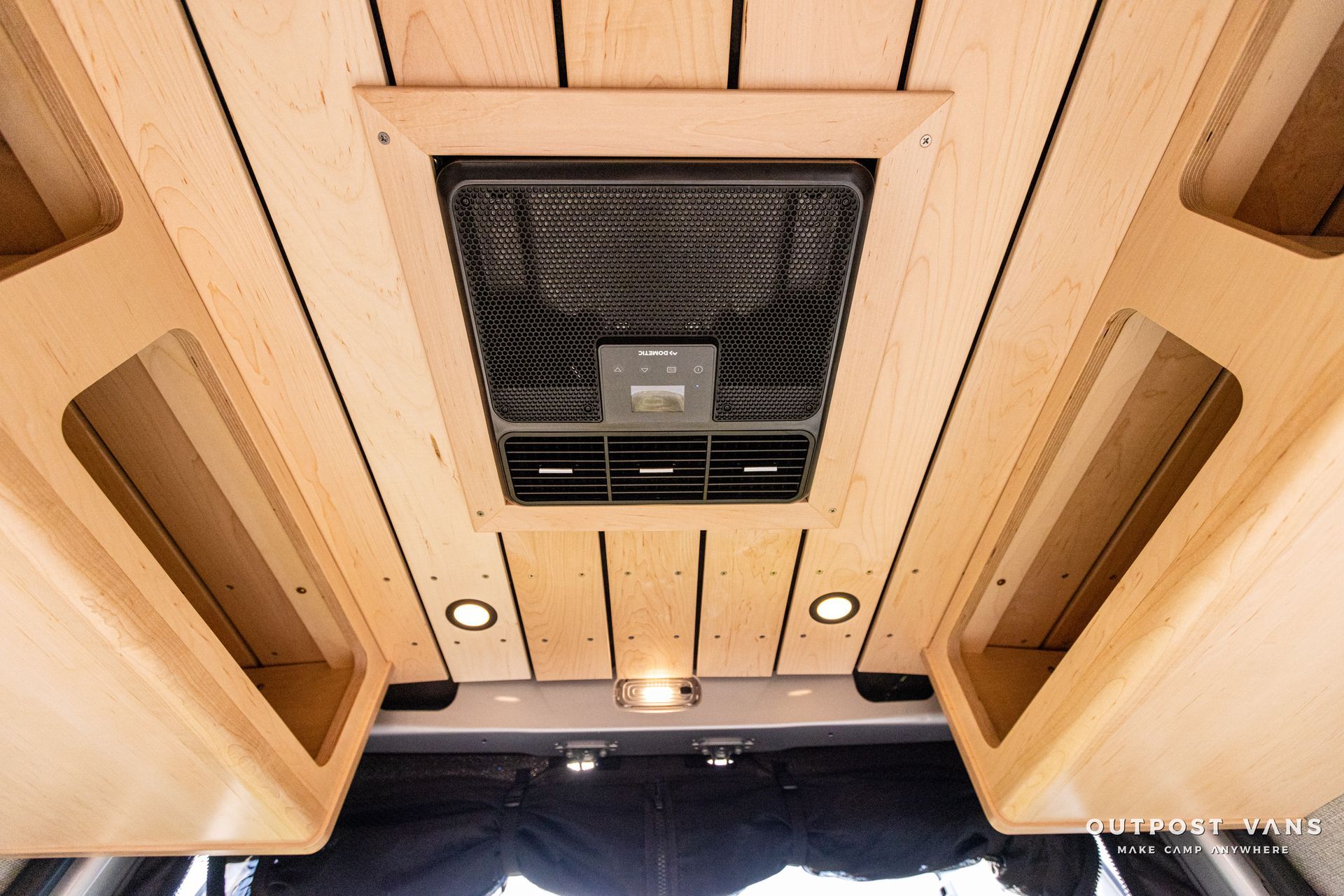 a ceiling fan is mounted to the ceiling of a van .