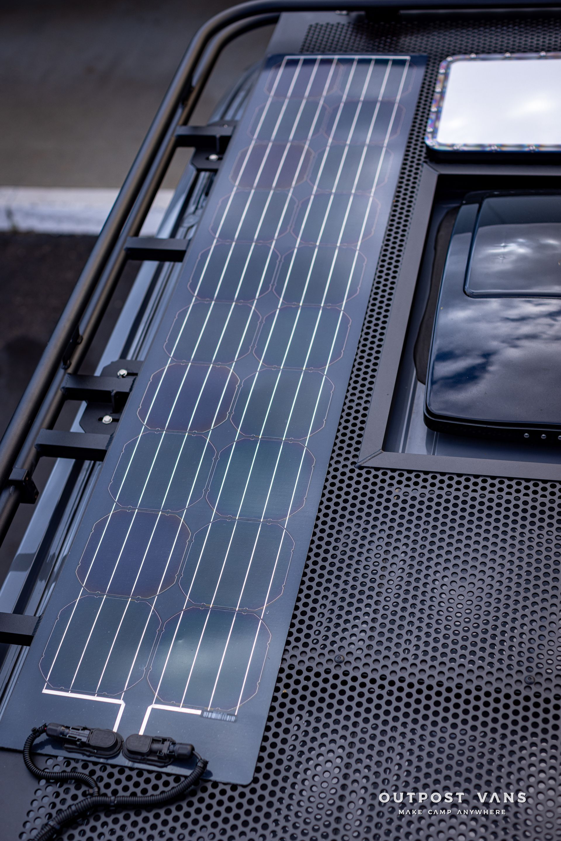 a solar panel is sitting on top of a roof rack .