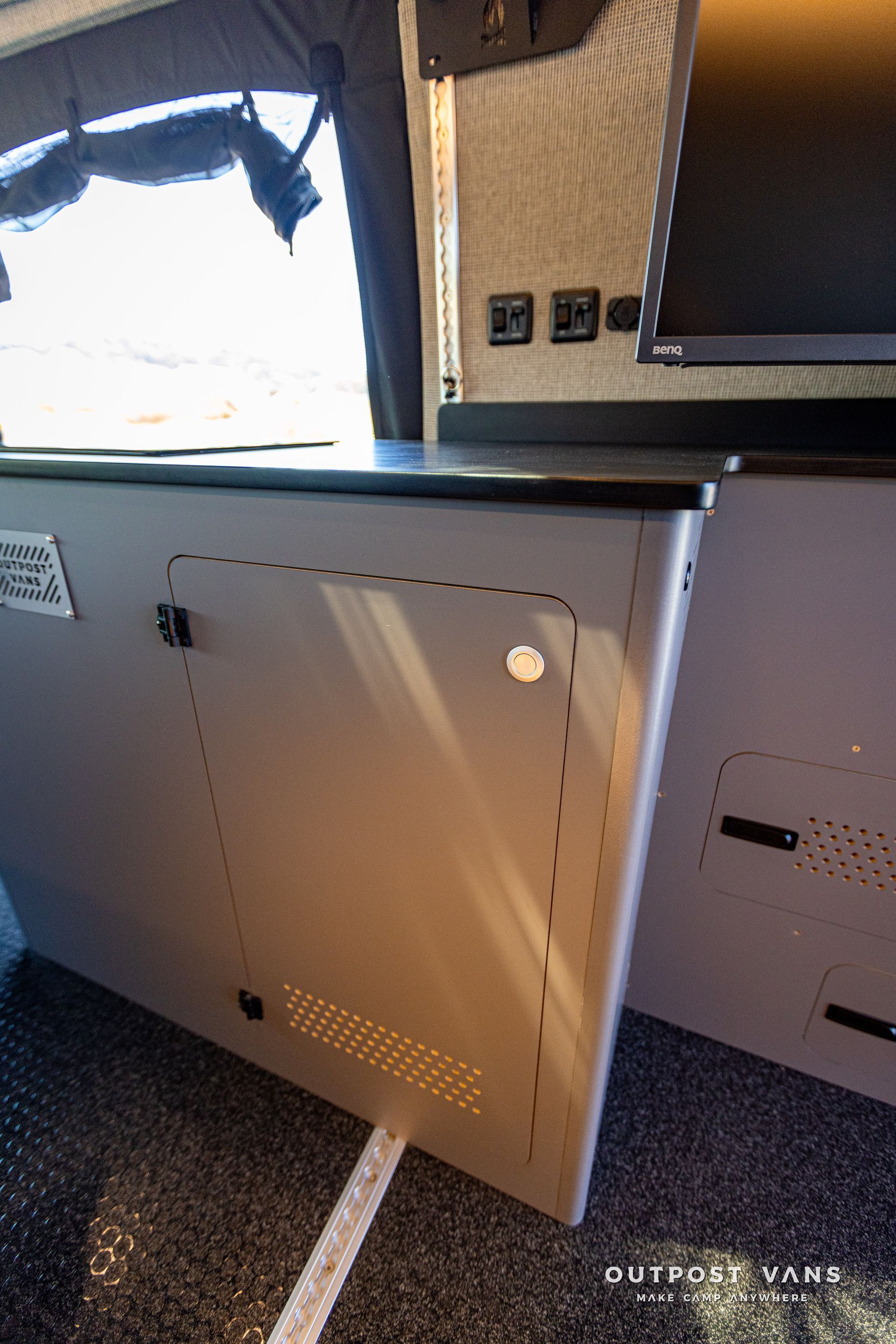 a close up of a cabinet in a camper van .