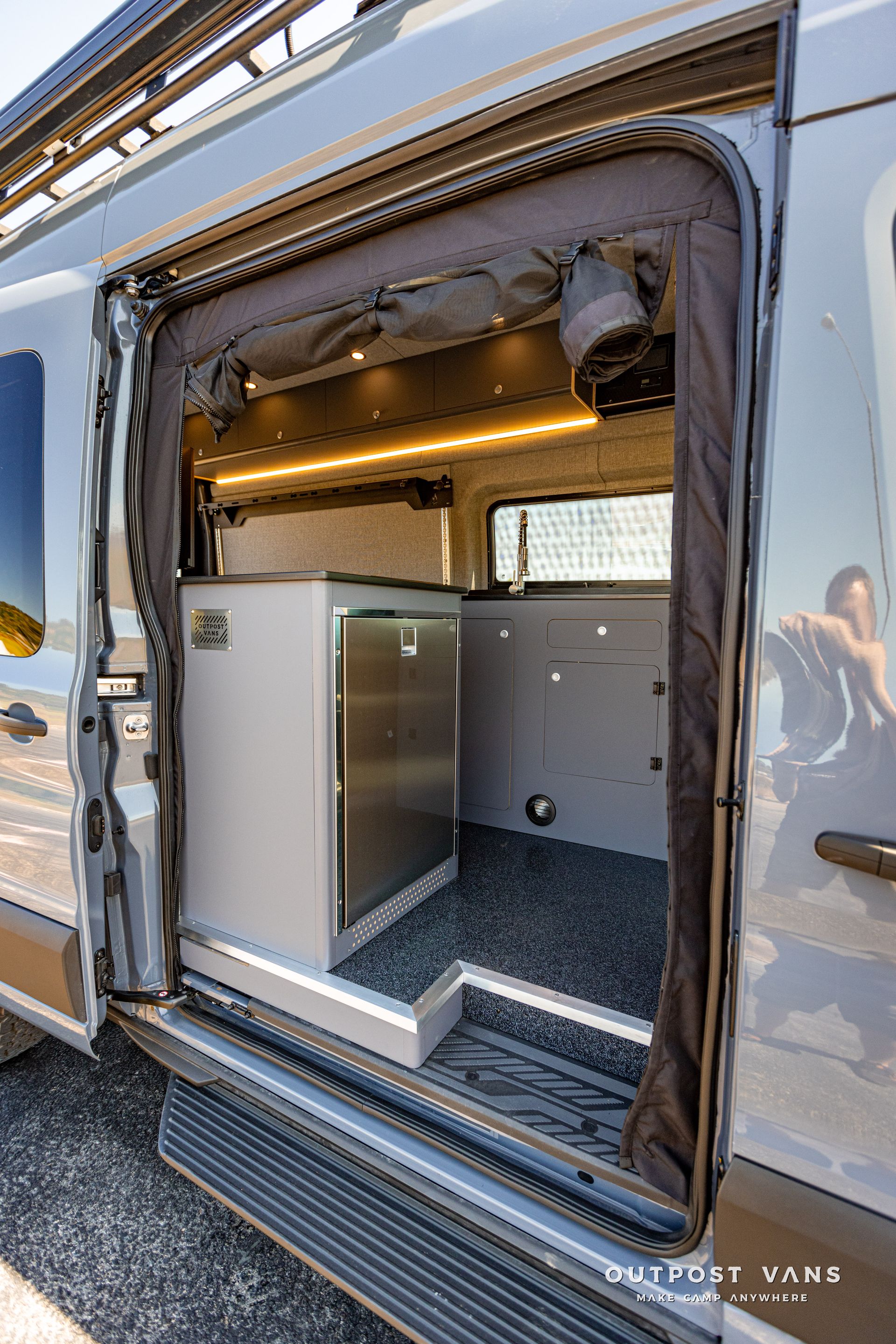 the door of a van is open and shows the inside of the van .