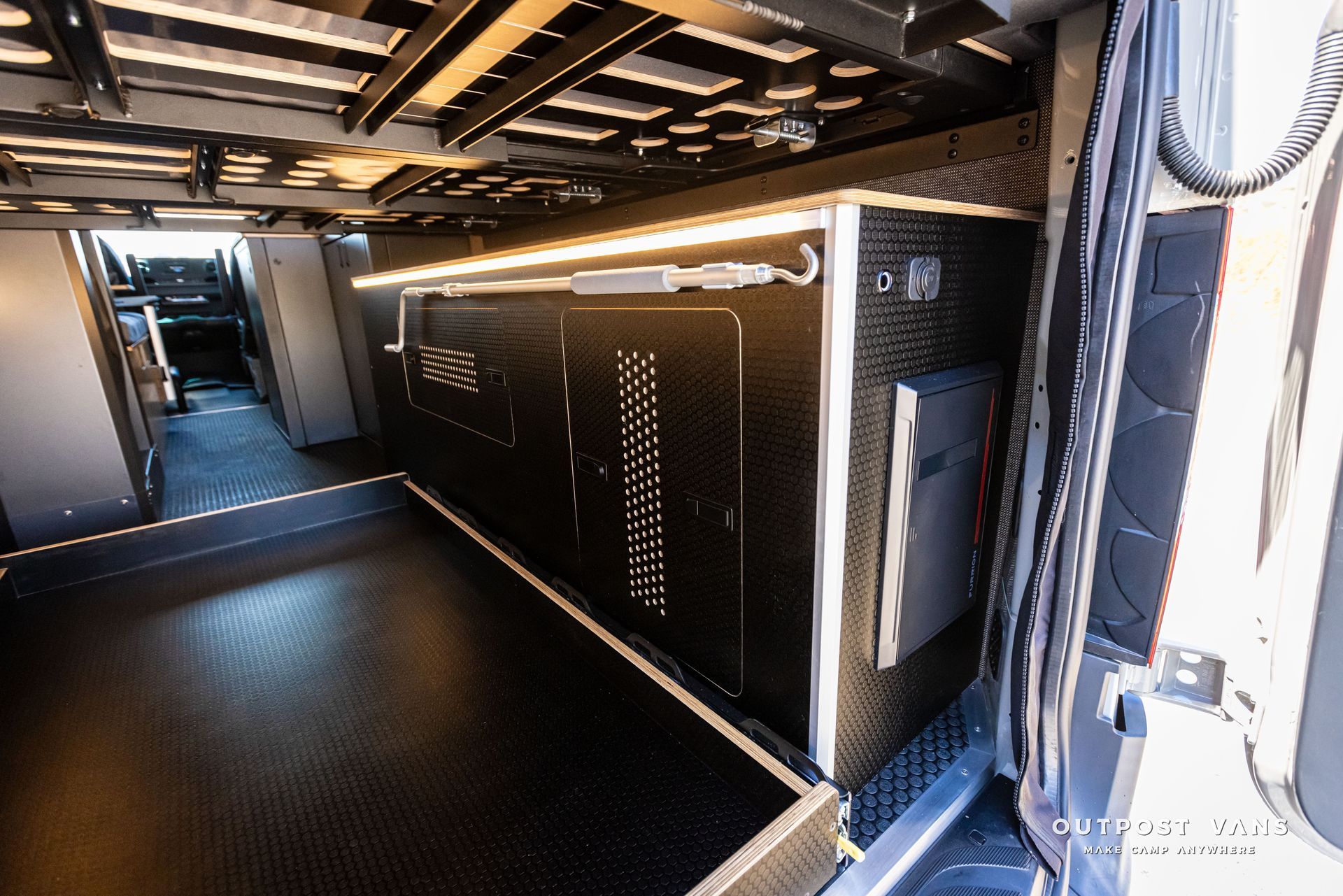 The inside of a van with a lot of storage space.
