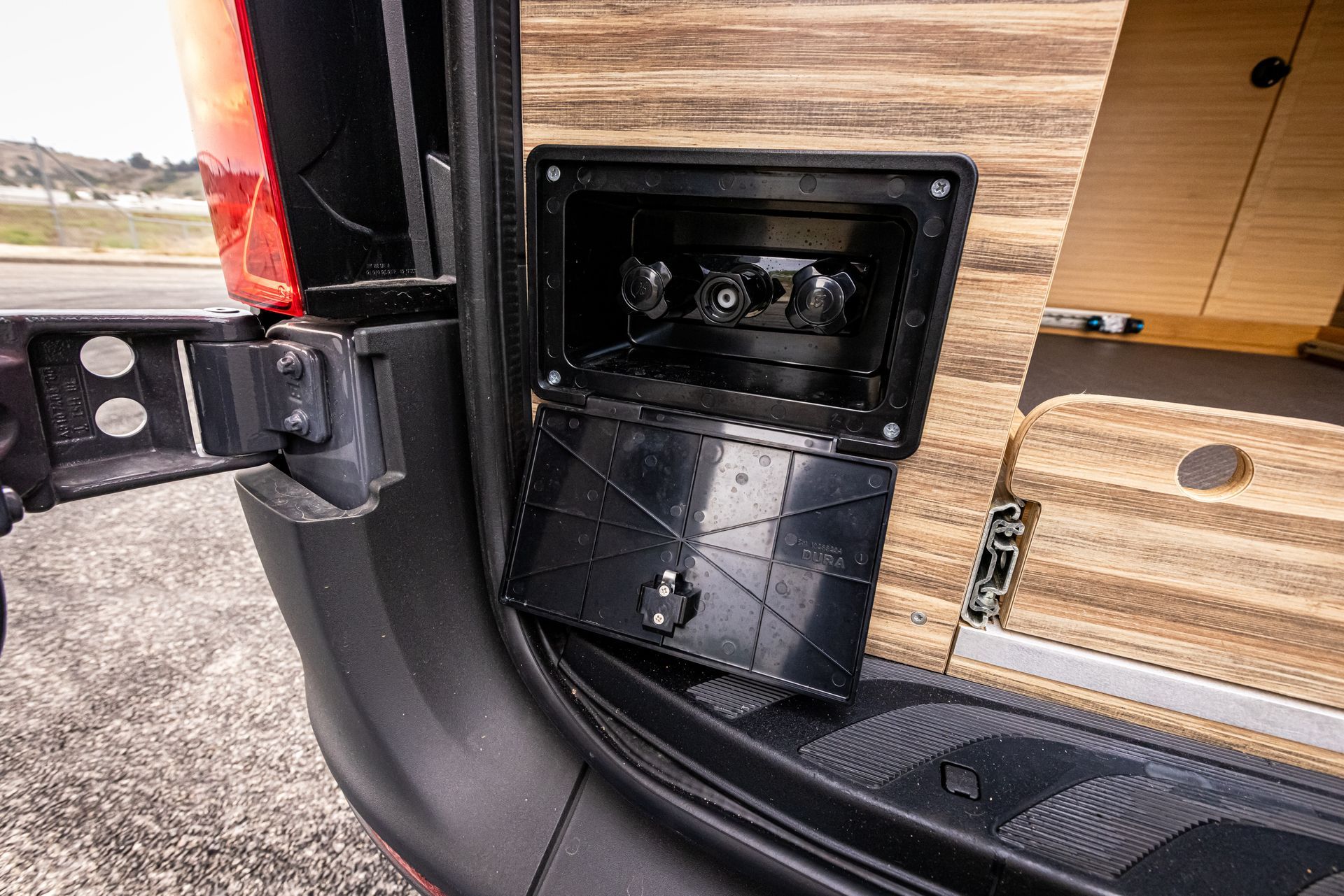 A close up of the back of a van with the door open.