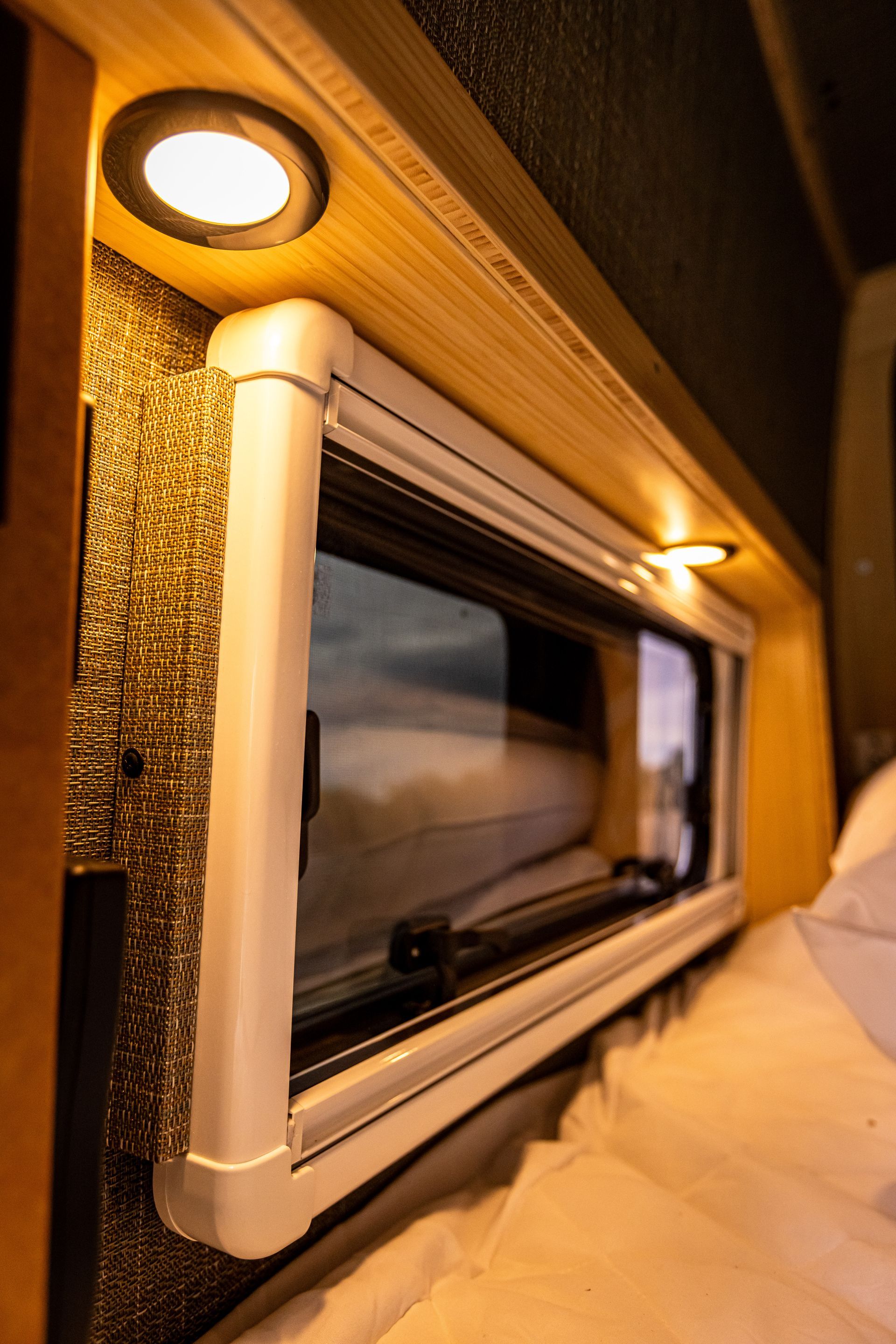 A close up of a window in a camper van.