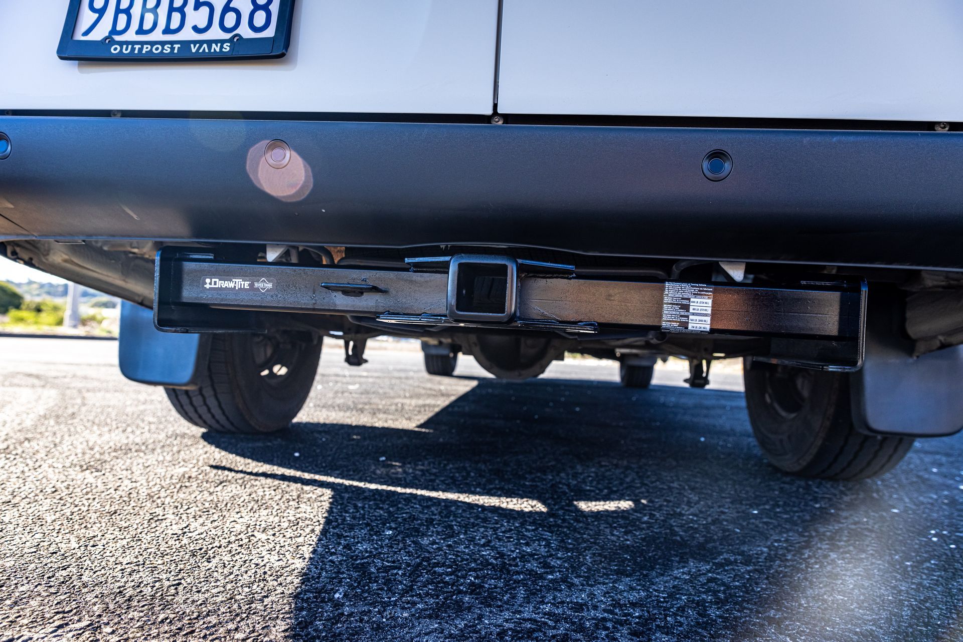 A white van with a license plate that says ybbb568