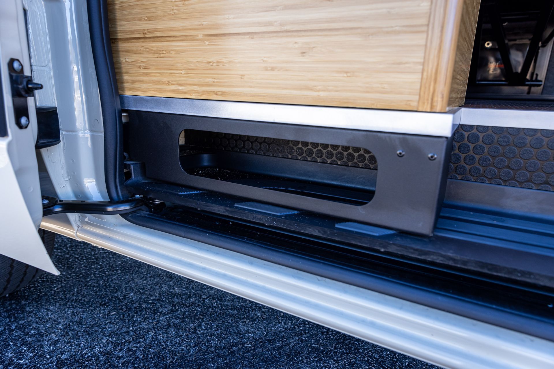 A close up of the side of a van with the door open.