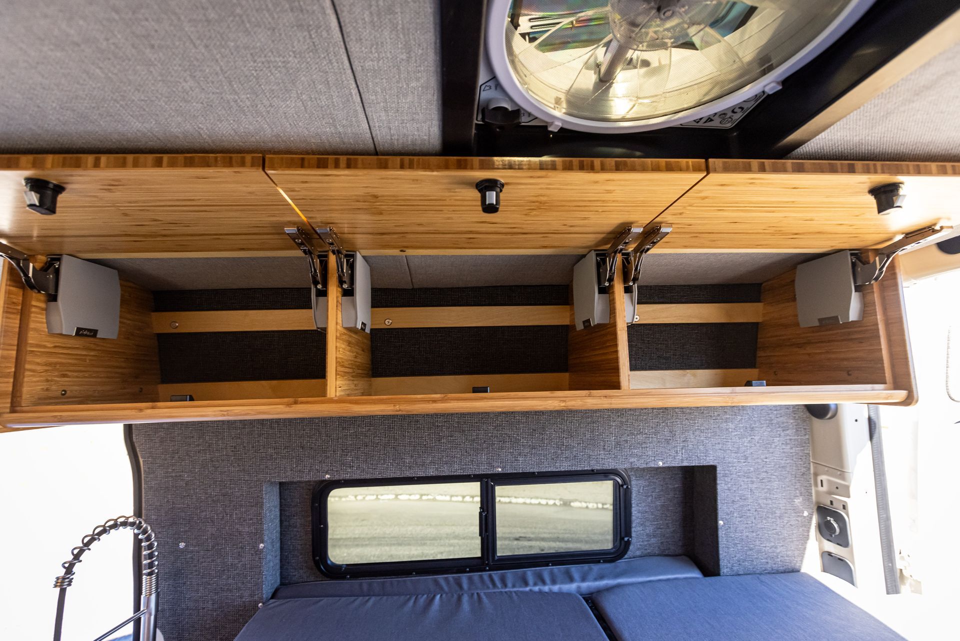 A ceiling fan is hanging from the ceiling above a couch.