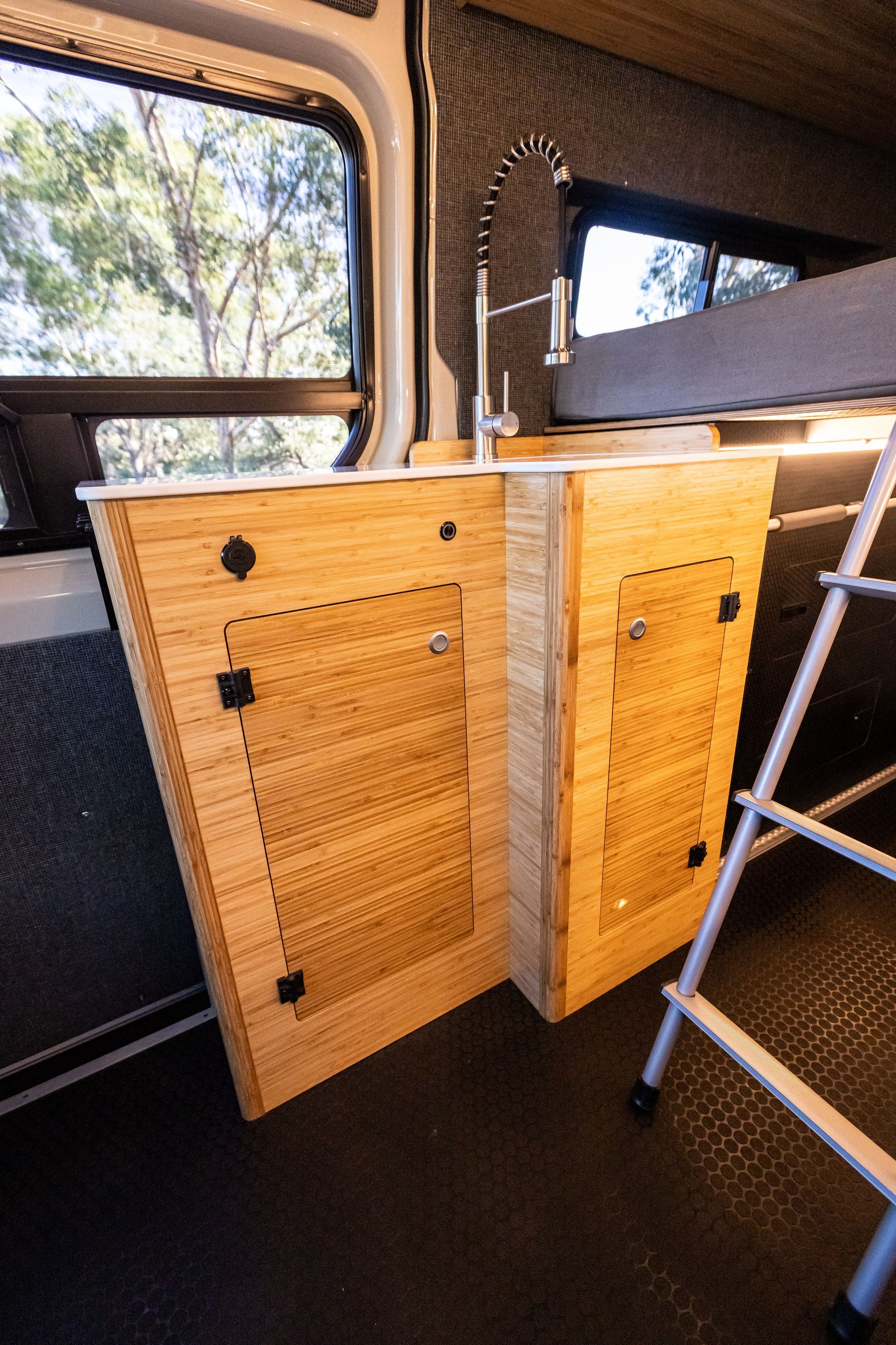 there is a ladder in the back of the van .