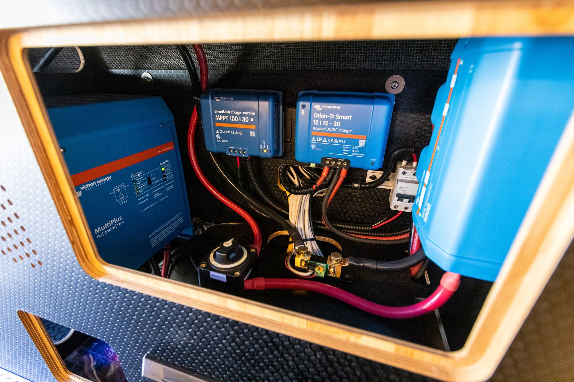 the inside of a boat with a lot of wires and electrical equipment .