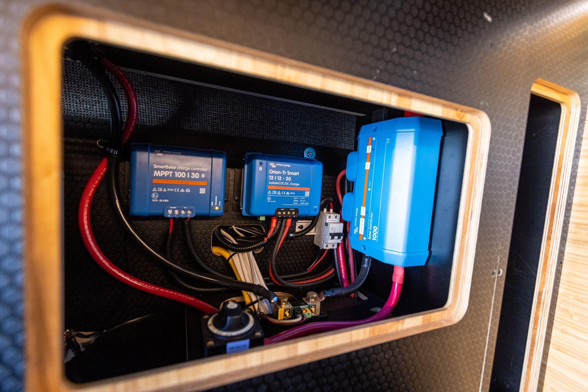 a close up of a box with a bunch of wires coming out of it .