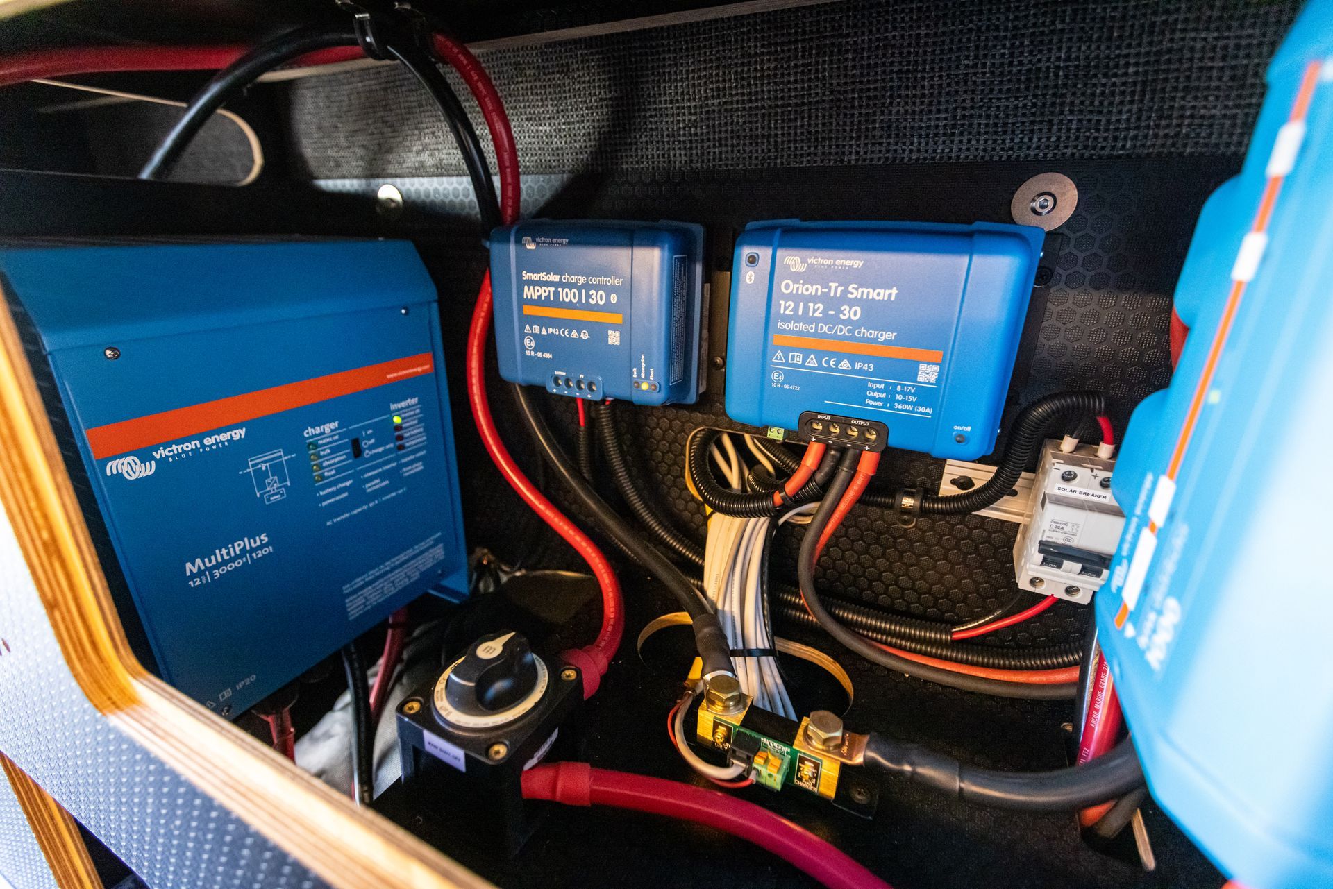 the inside of a boat with a lot of wires and electrical equipment .