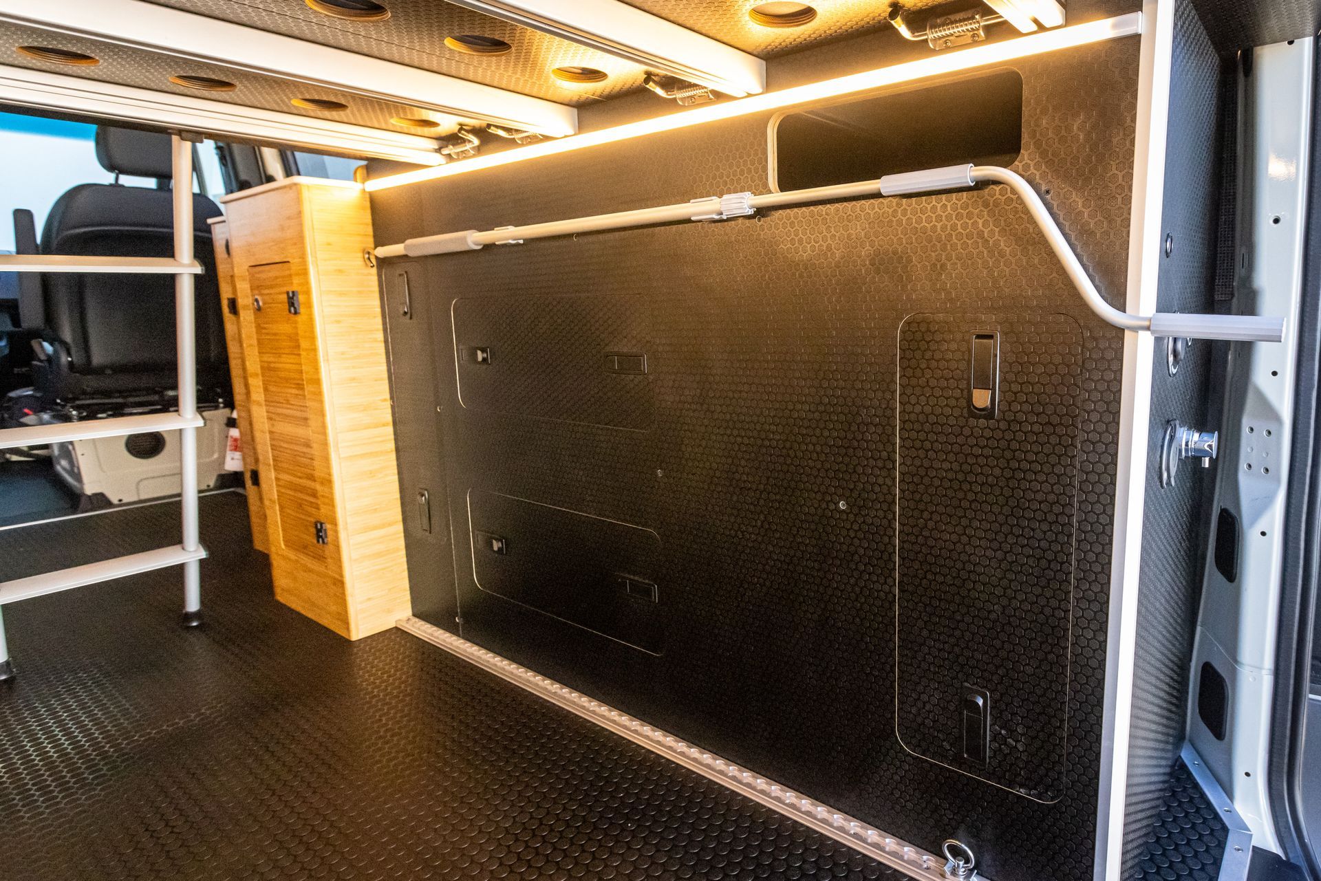 there is a ladder in the back of the van .