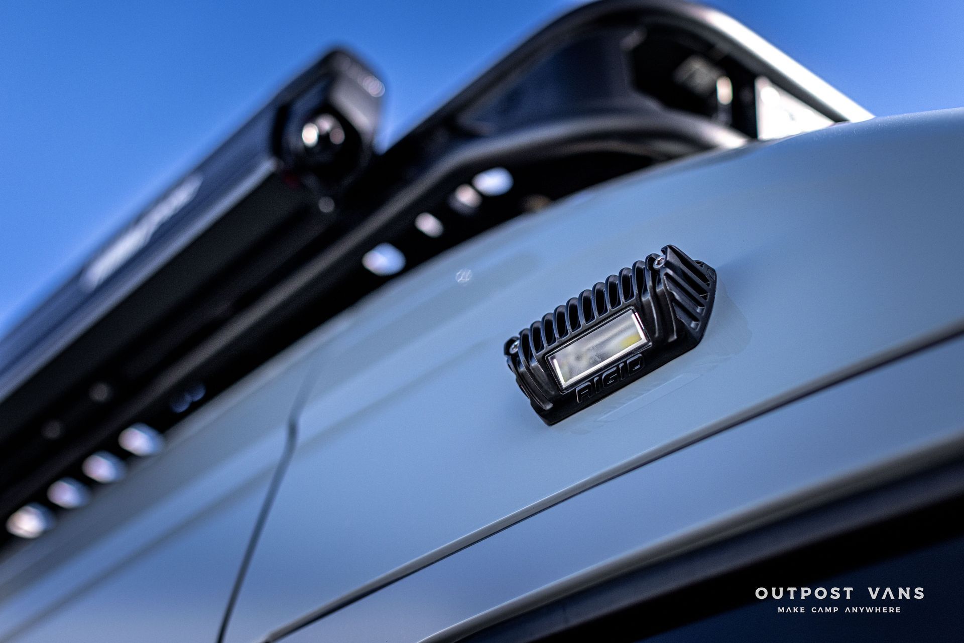 the word outpost is on the side of a car