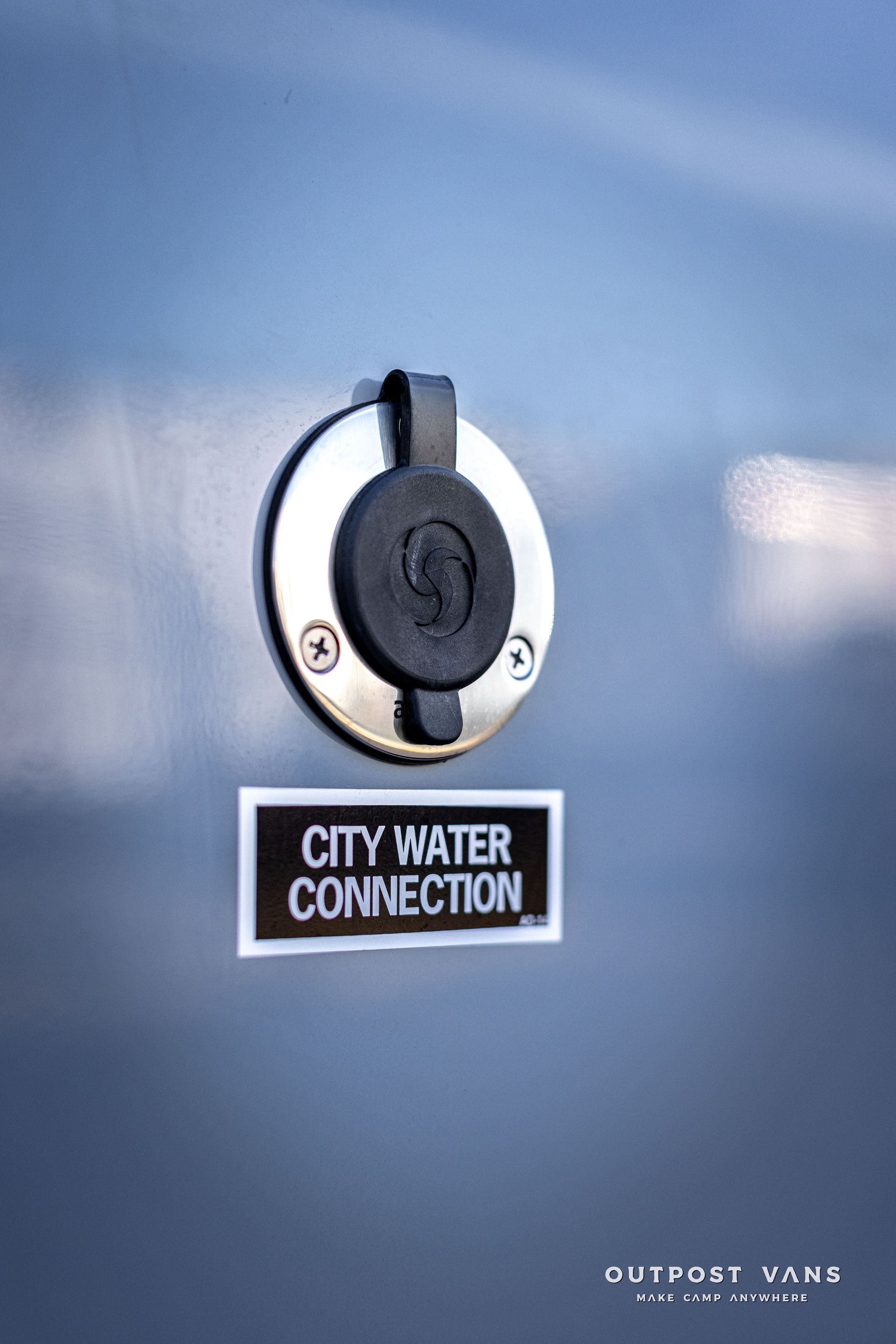 a close up of a city water connection on a vehicle .