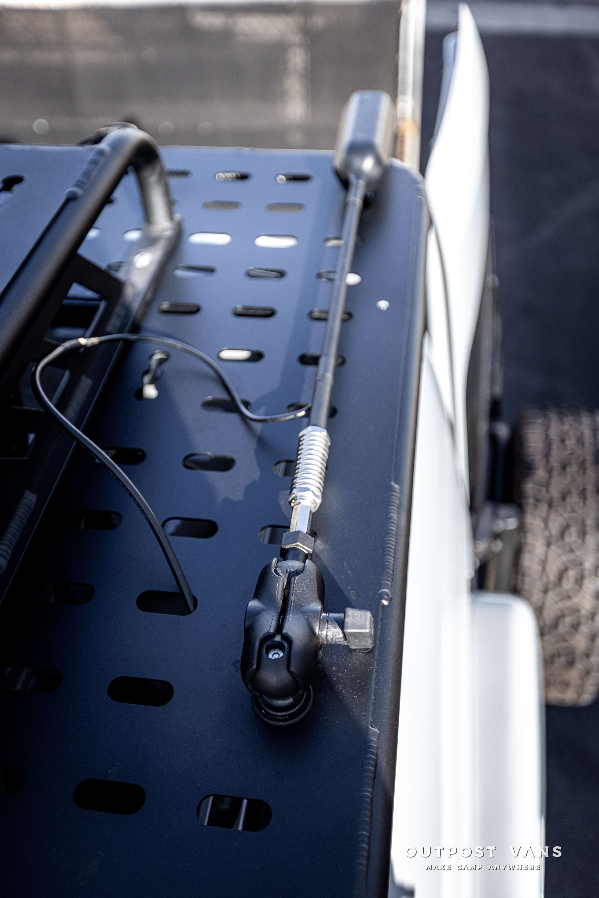 a close up of a roof rack on a truck with a antenna attached to it .