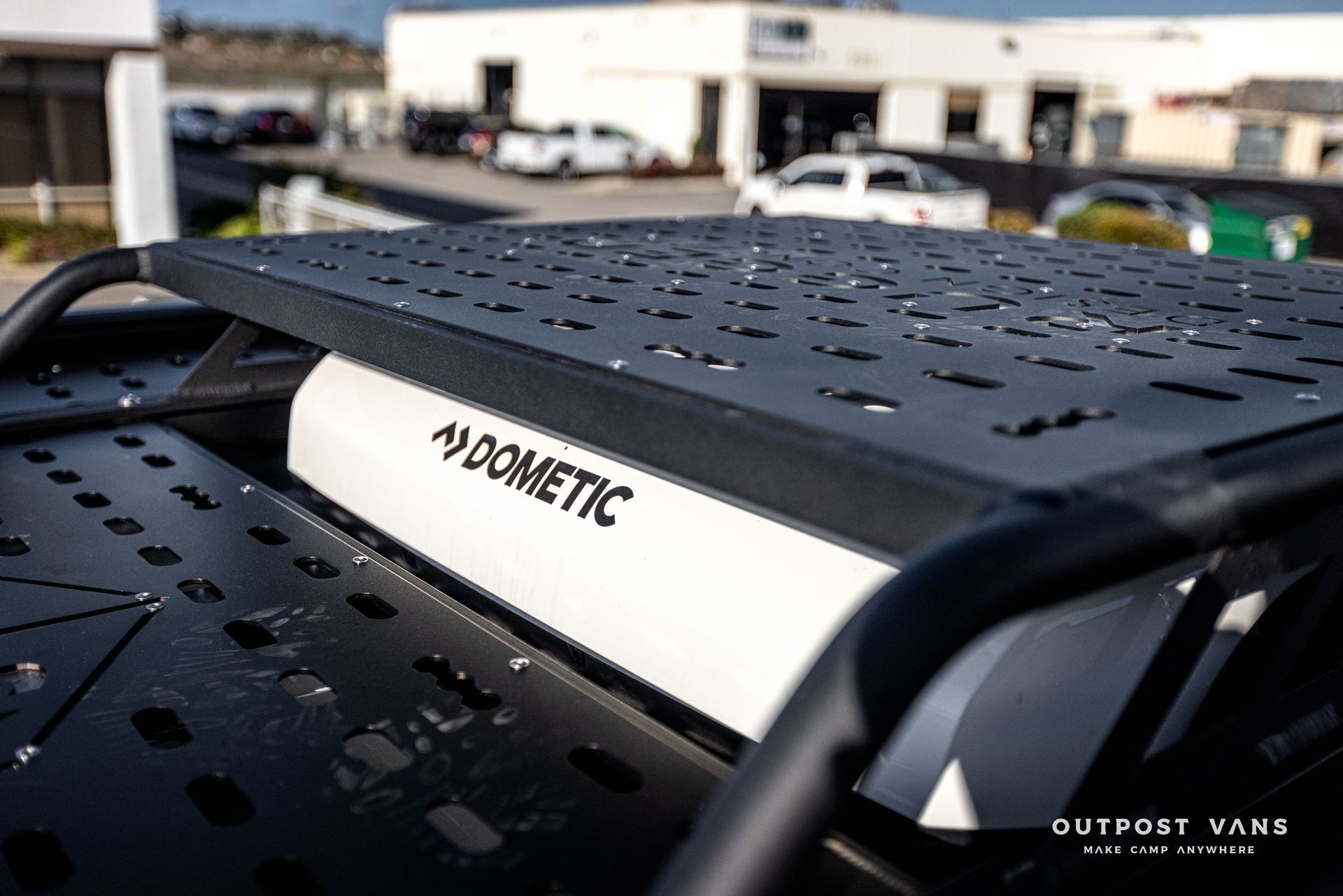 a dometic roof rack is sitting on top of a car .