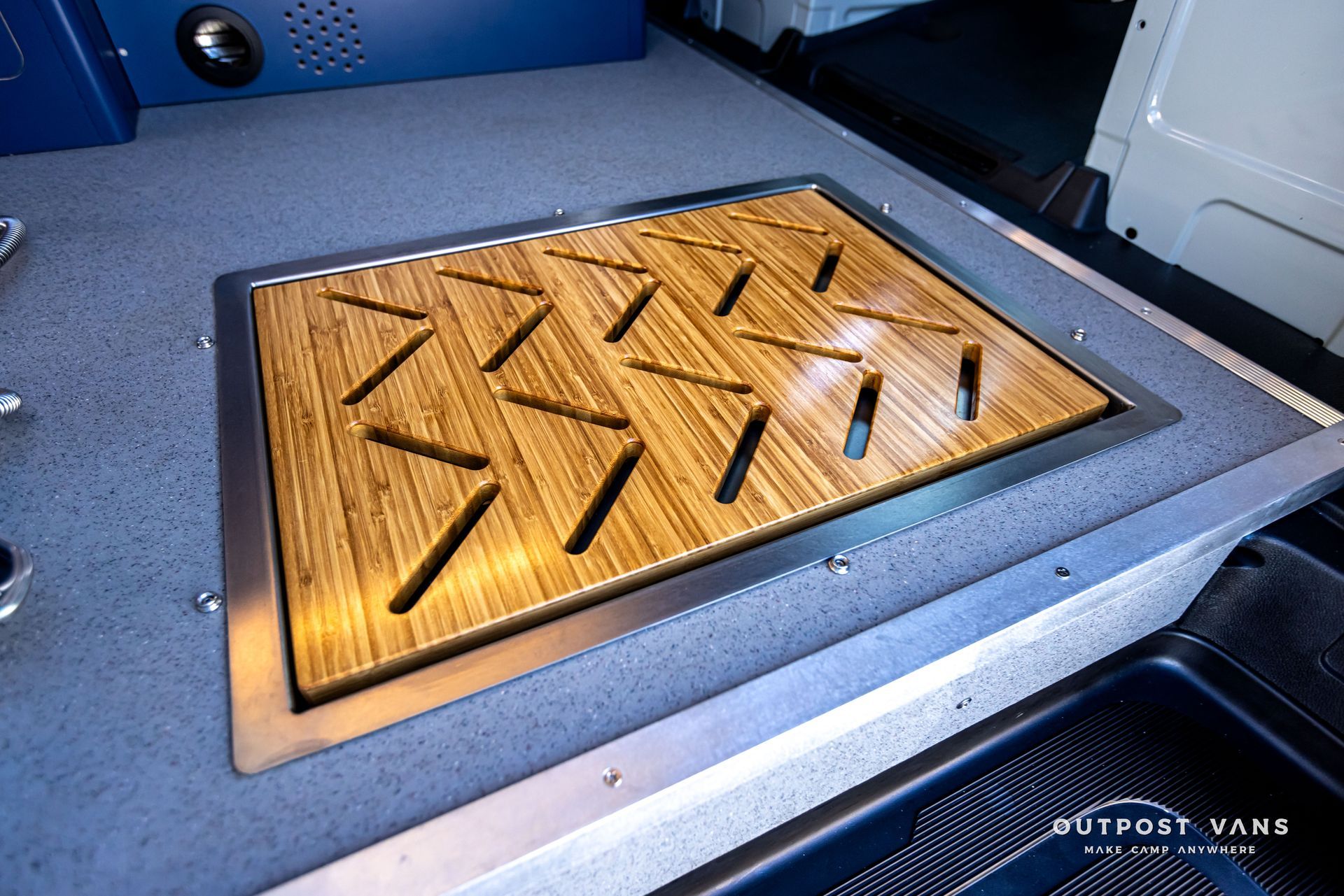 A wooden floor with a stainless steel frame