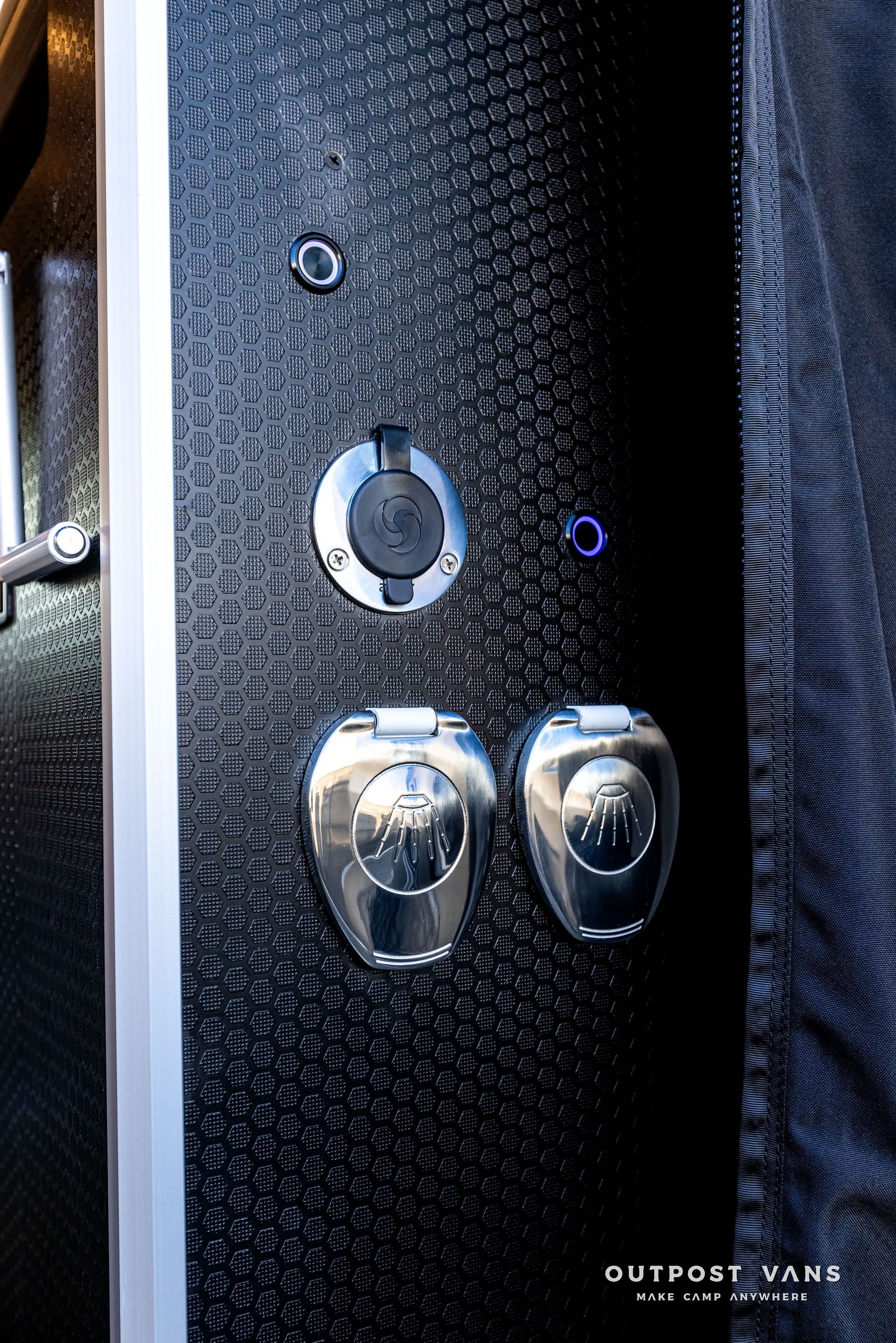 A close up of a door with two buttons on it.
